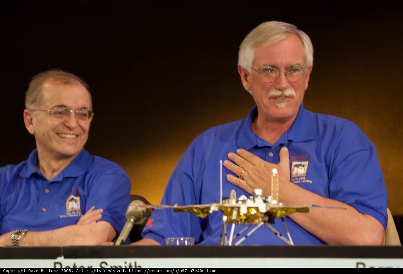 Charles Elachi and Companion with Model Airplane at Phoenix Landing Press Conference