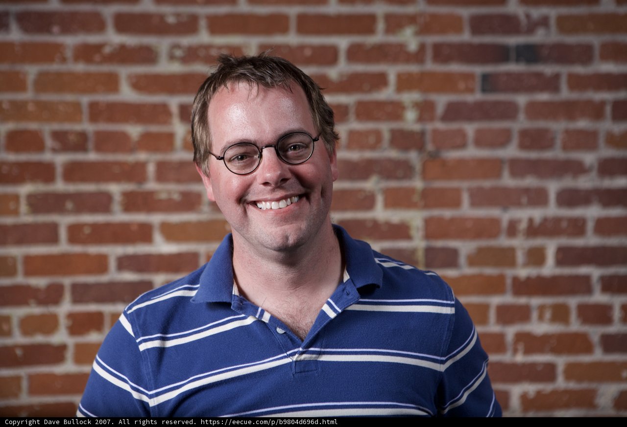 Smiling Man with Glasses