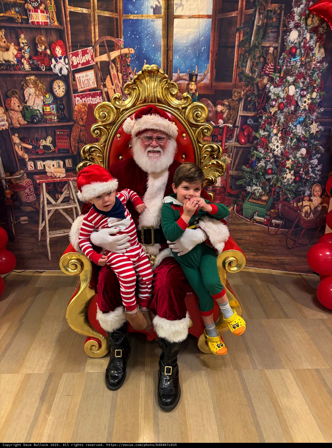 Two Children Visit Santa in His Christmas Workshop
