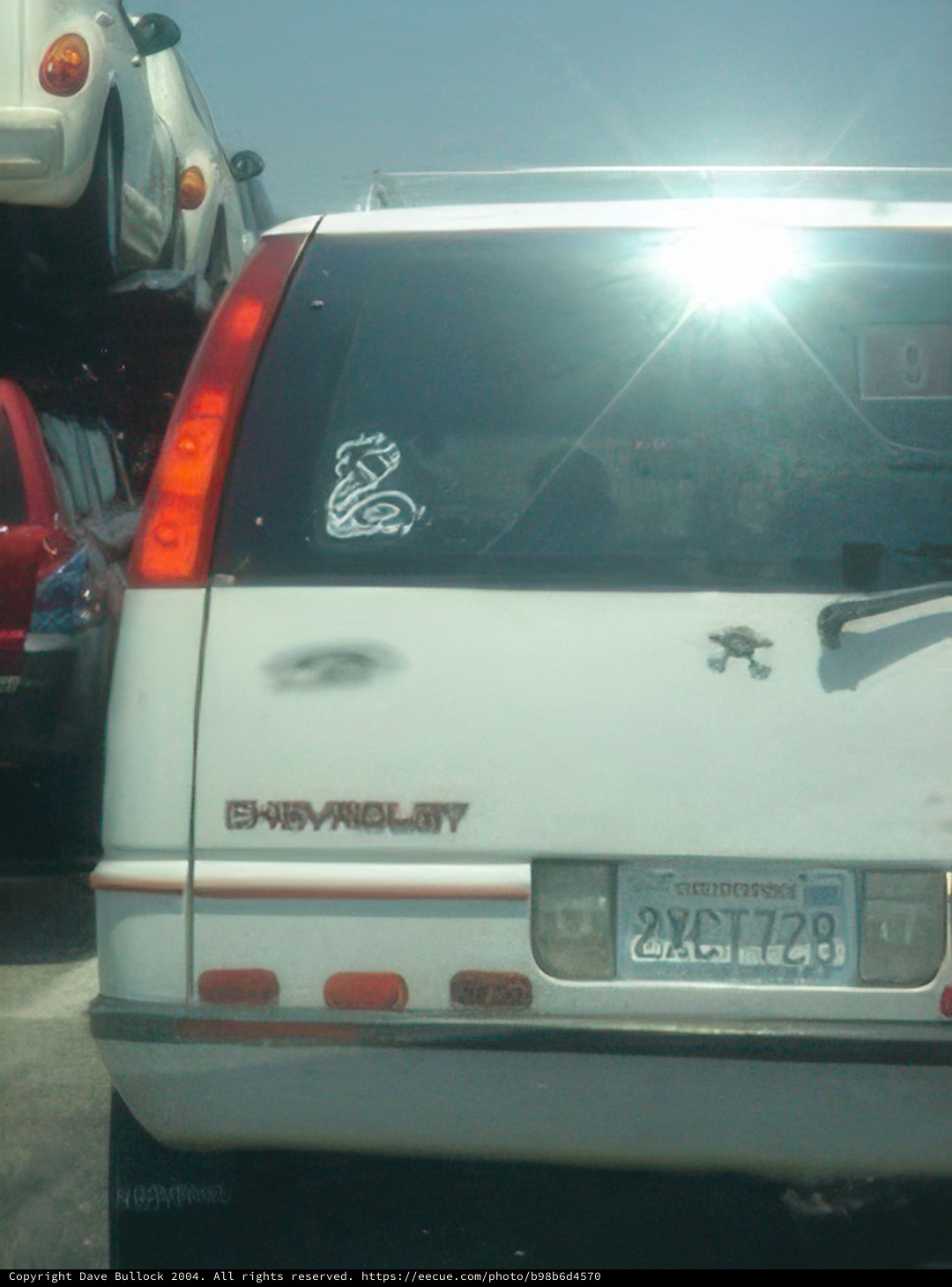 White Car with Back Sticker