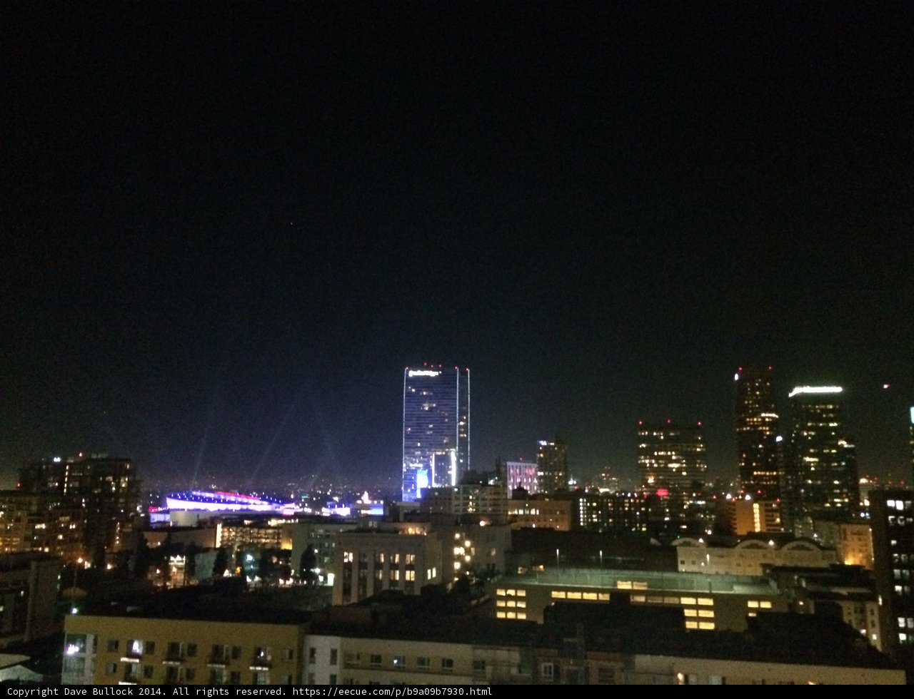 Night View of the City Skyline from a Rooftop