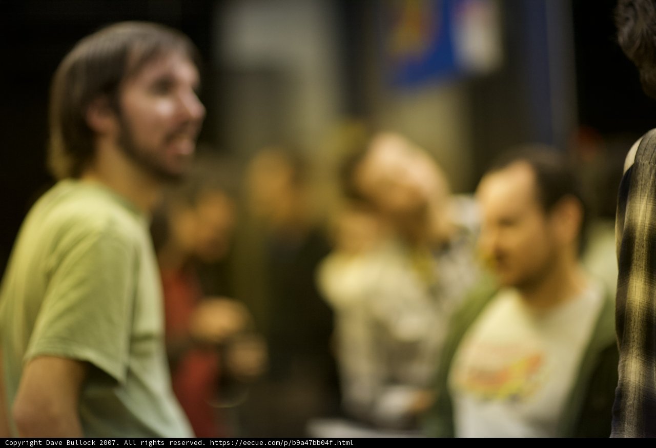 Blurry Bearded Man in Garnet T-Shirt