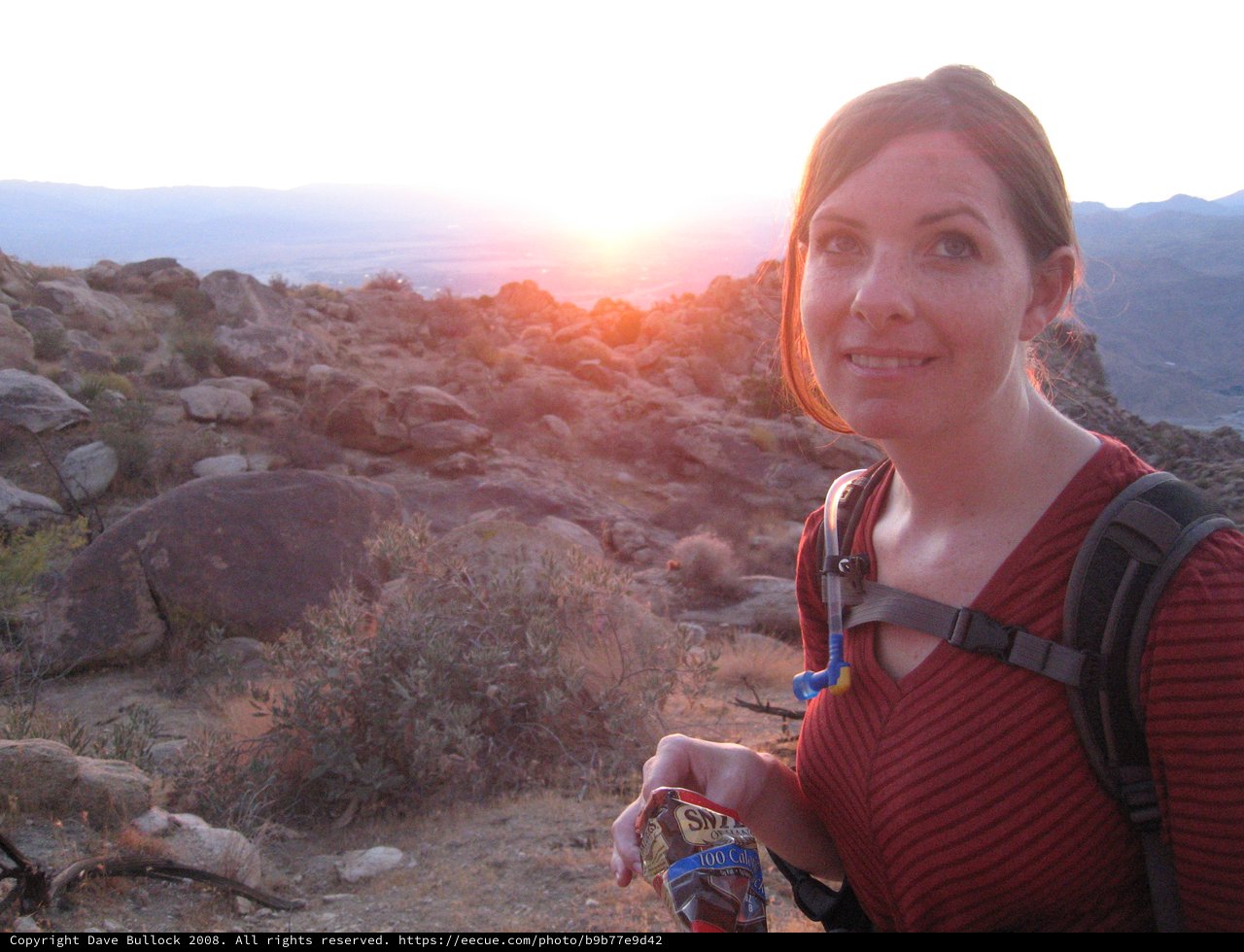 Desert Hiker Pauses at Golden Sunset Summit