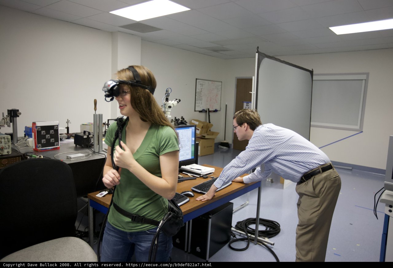 Two Professionals Collaborating in a High-Tech Room