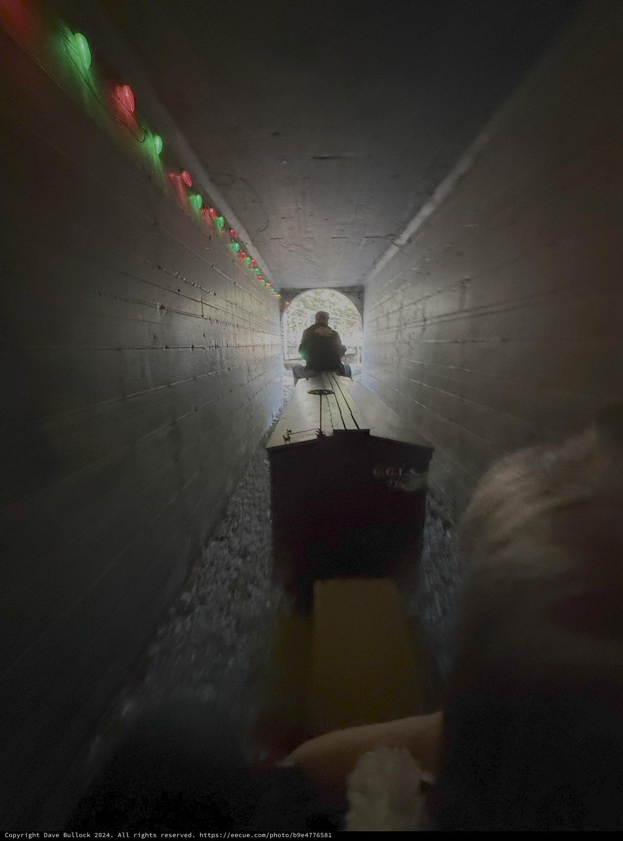 Underground Tunnel with Holiday Lights and Cart