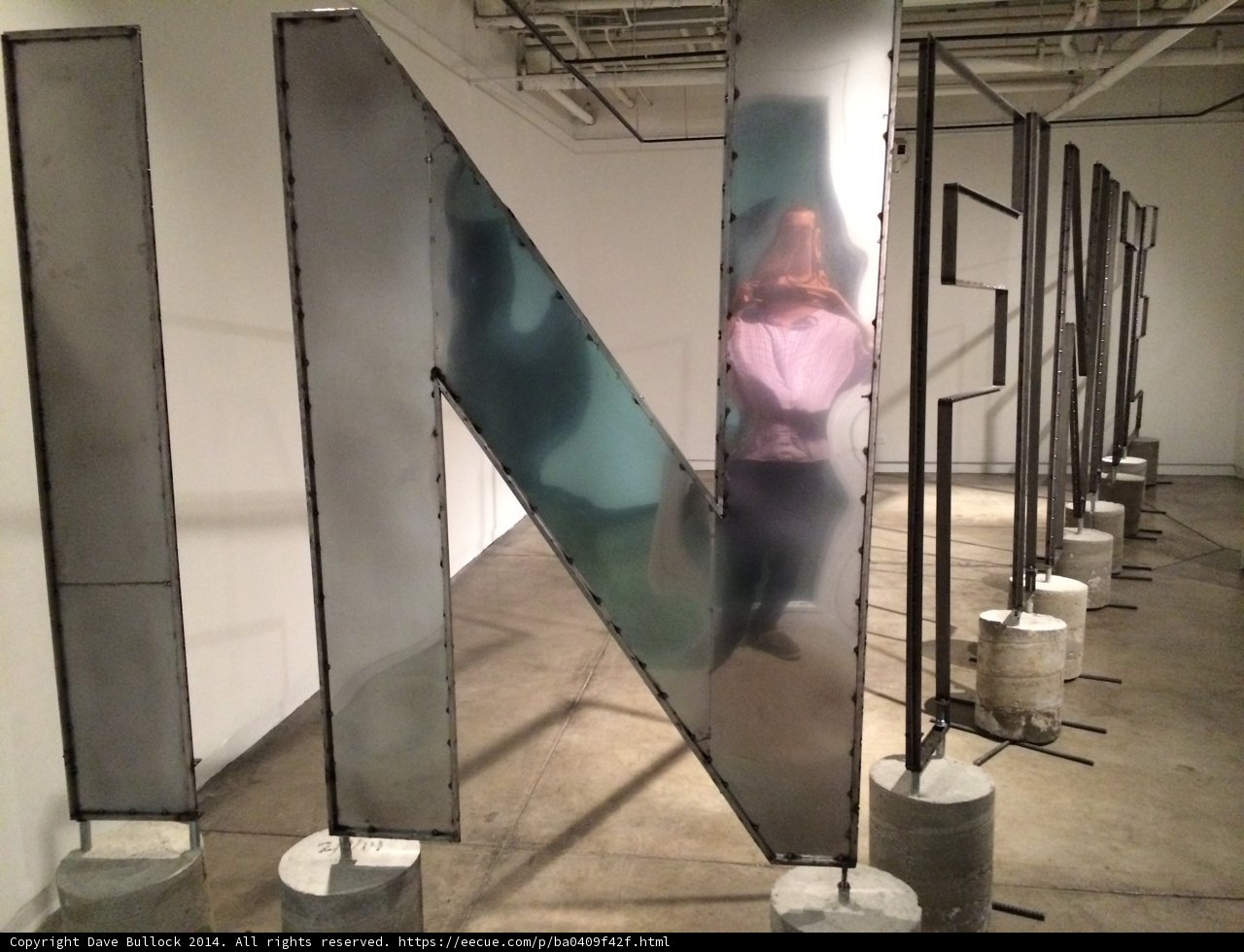 Metal Sculpture and the Woman