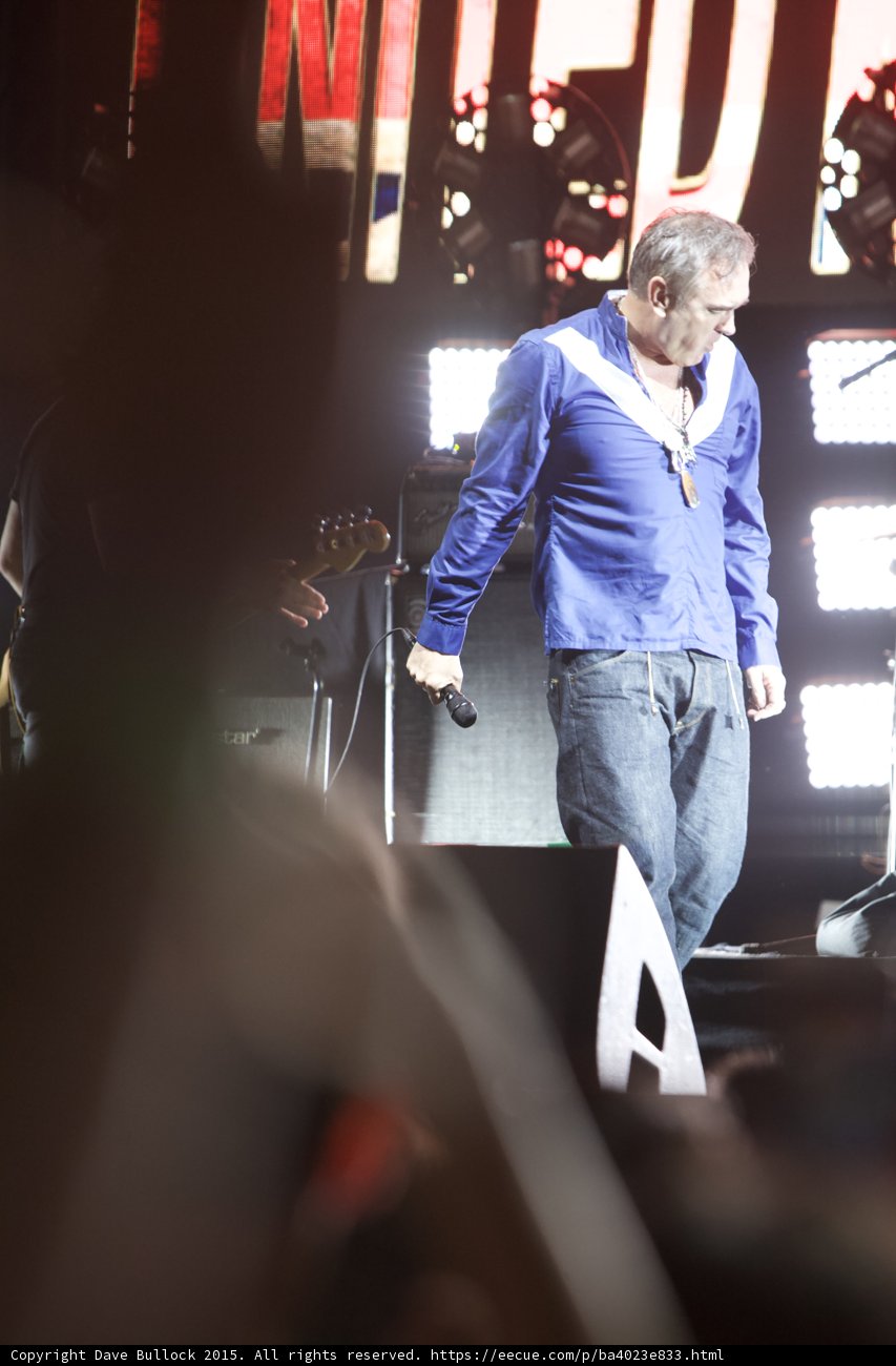 Morrissey Looking Down Contemplative Blue Shirt Mic At Side Bassist Blackstar UNITED Screen Crowd