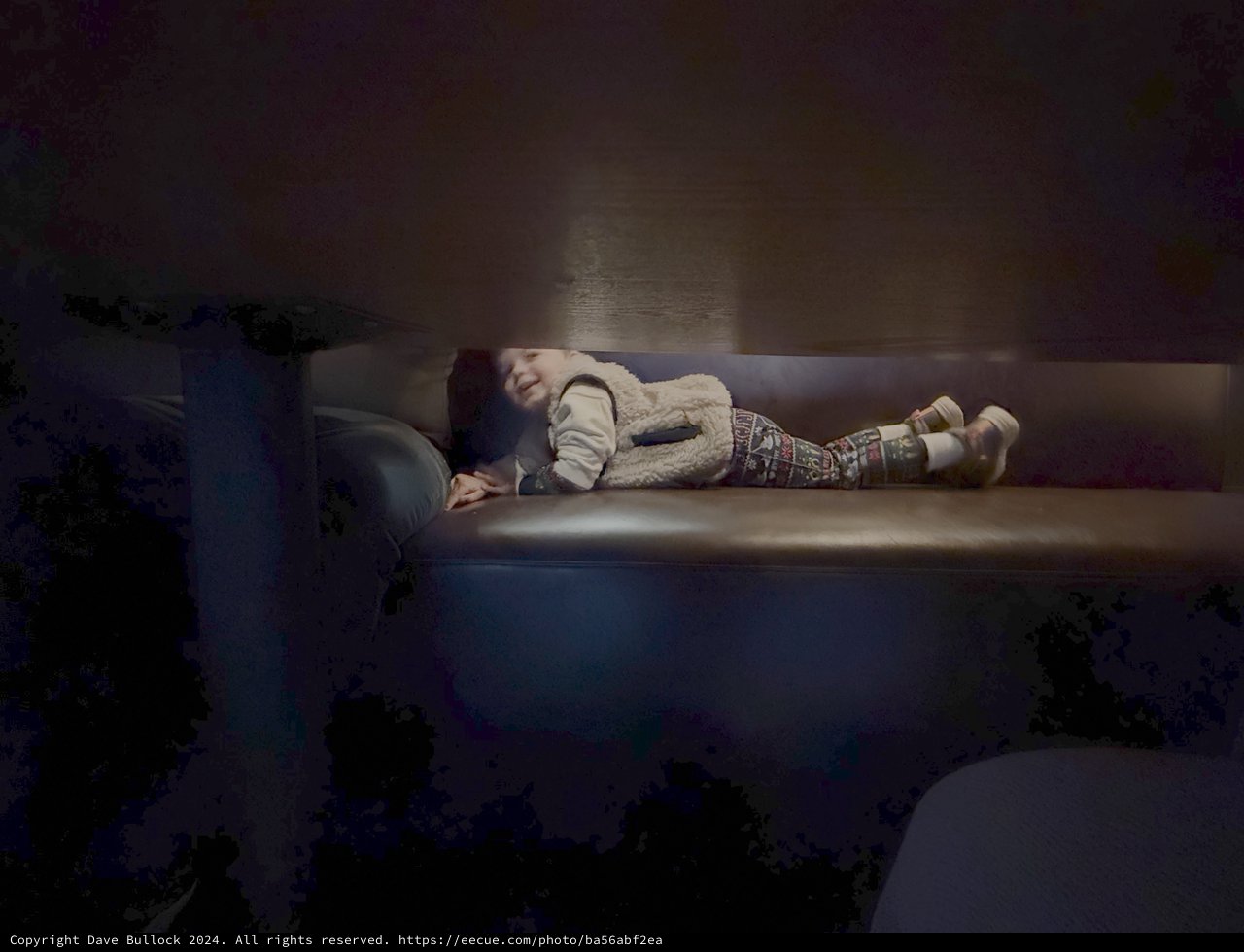 Child Resting Peacefully on Living Room Couch