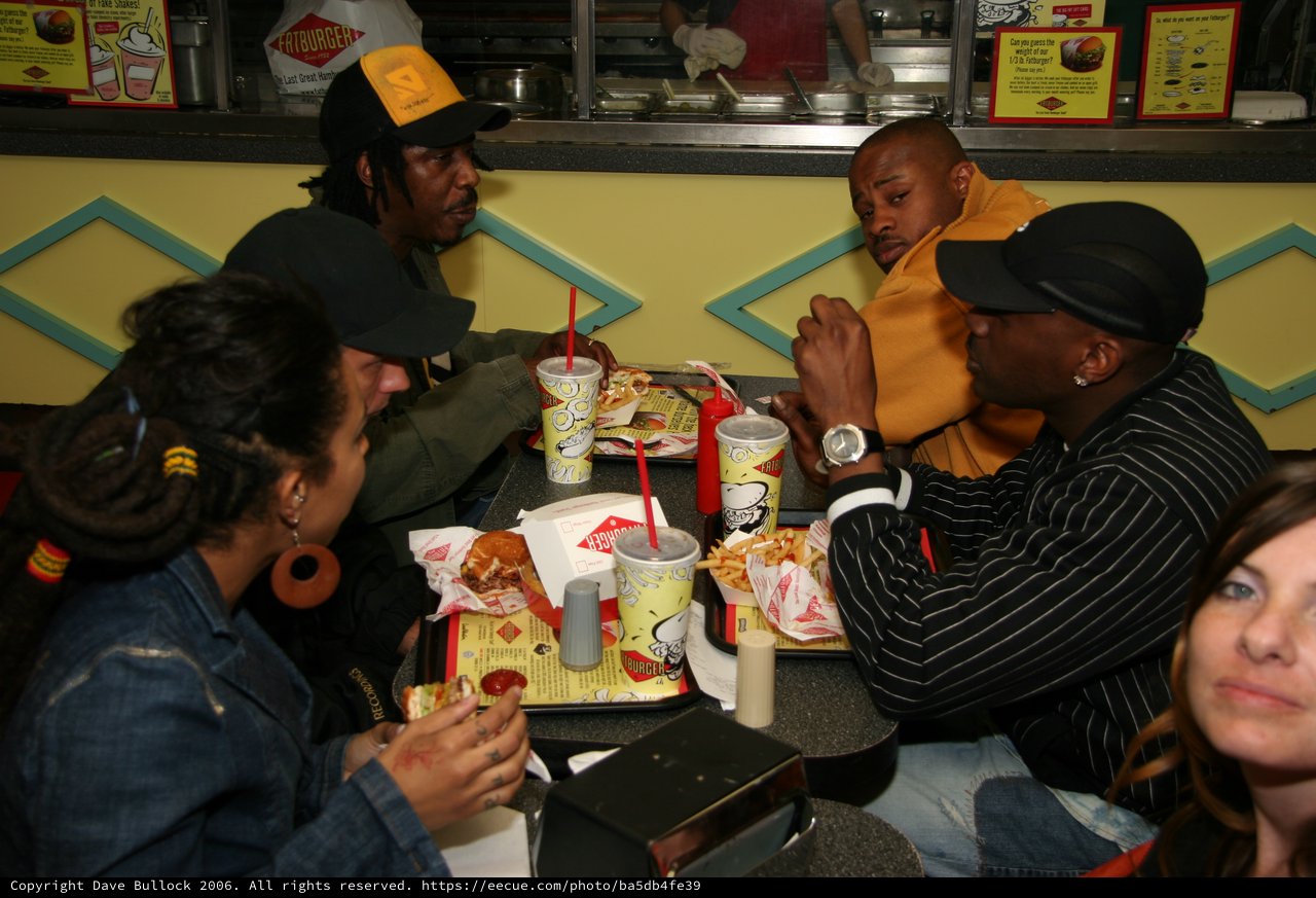 Friends Sharing a Meal at Fatburger Restaurant