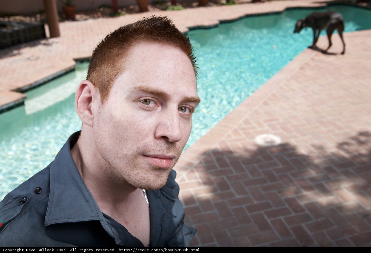 Blue Shirt Man by the Pool