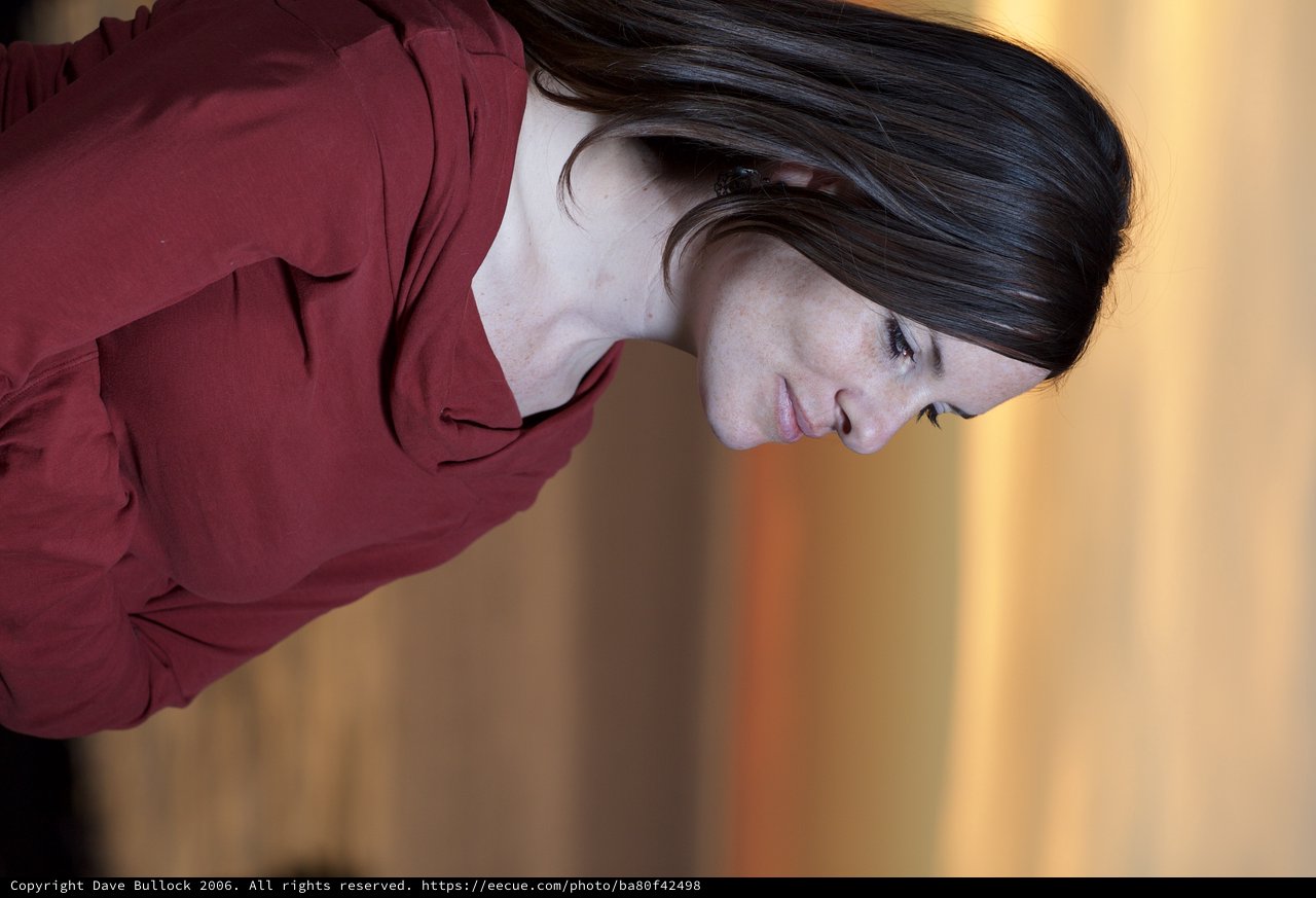 Woman in Red Gazing at a Golden Sunset