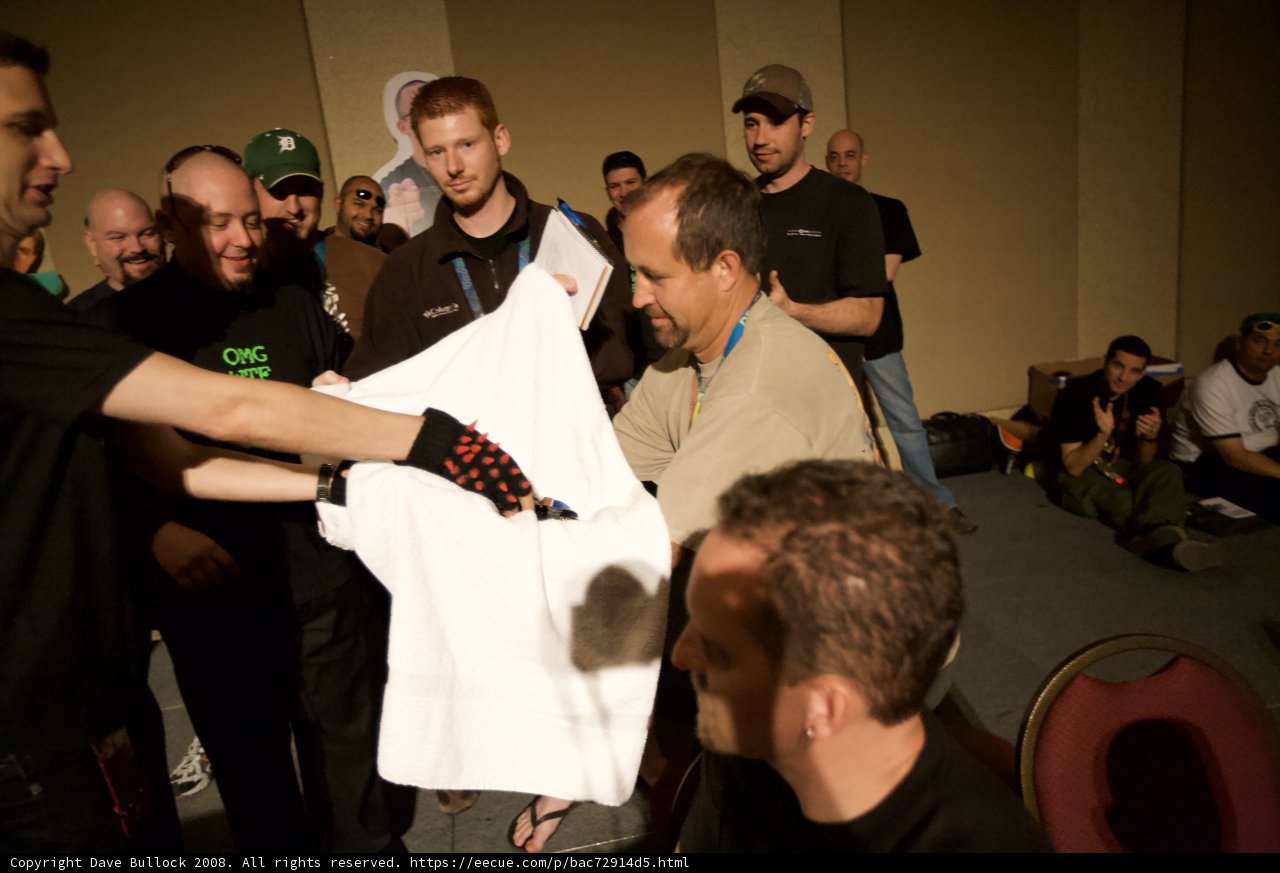 Group Gathering Around White T-Shirt