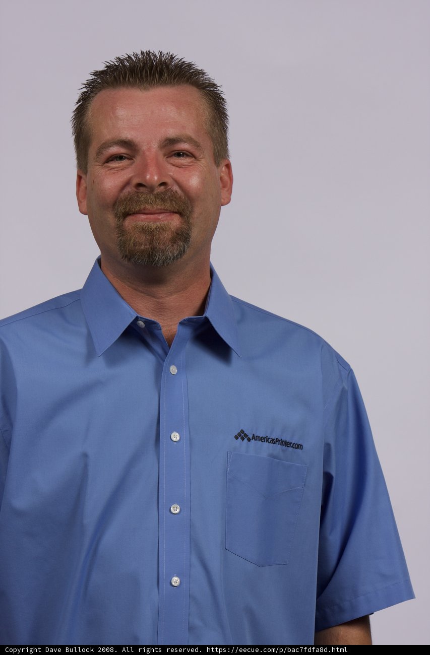 Smiling Man in Blue Shirt and Tie