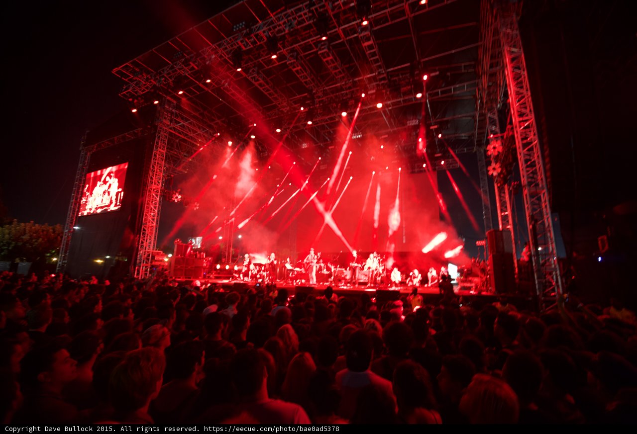FYF Fest Wide Stage Red Lighting Large Ensemble Video Screens Spotlight Beams Crowd Night