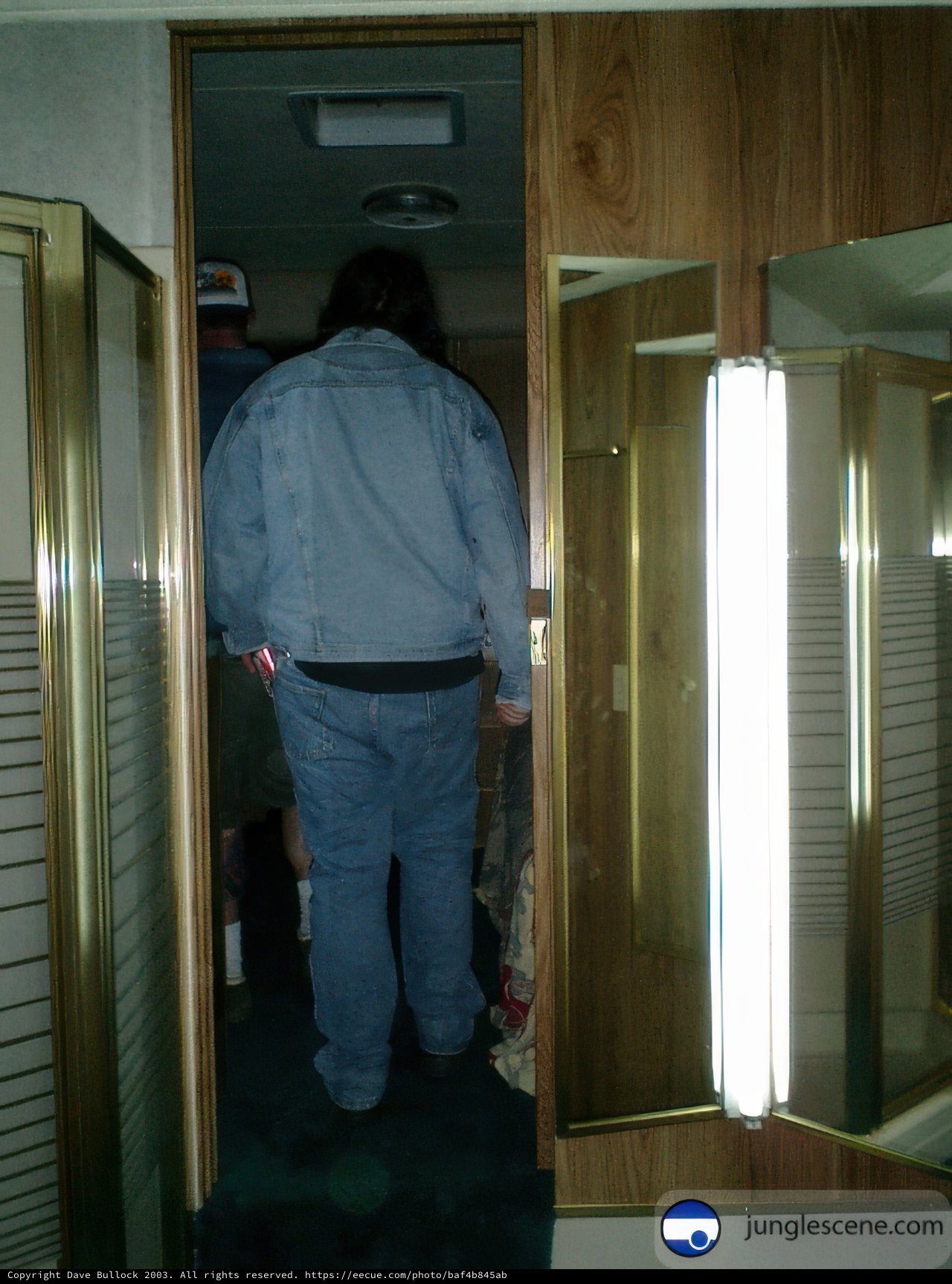 Blue Jacket Man by the Folding Door