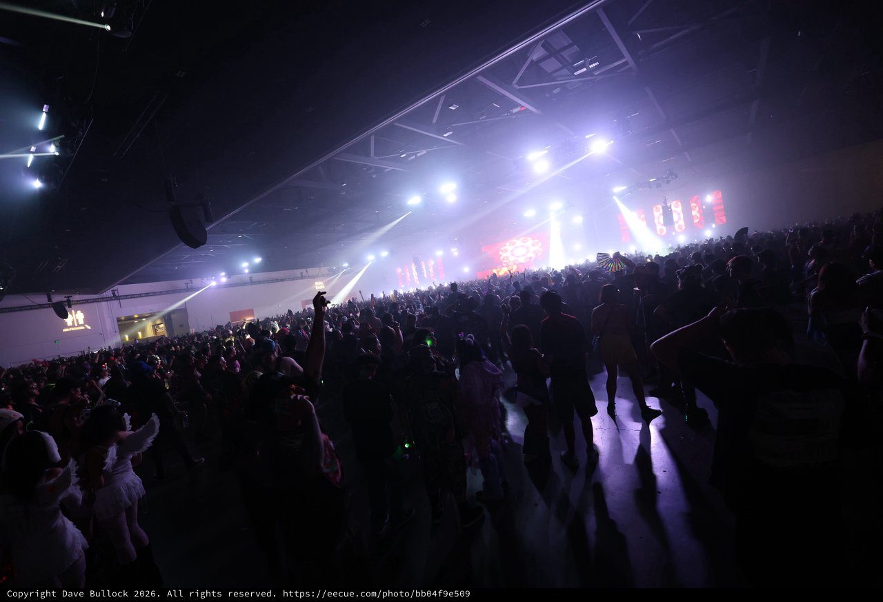 Massive Indoor Rave Crowd Surges Toward Blazing Stage
