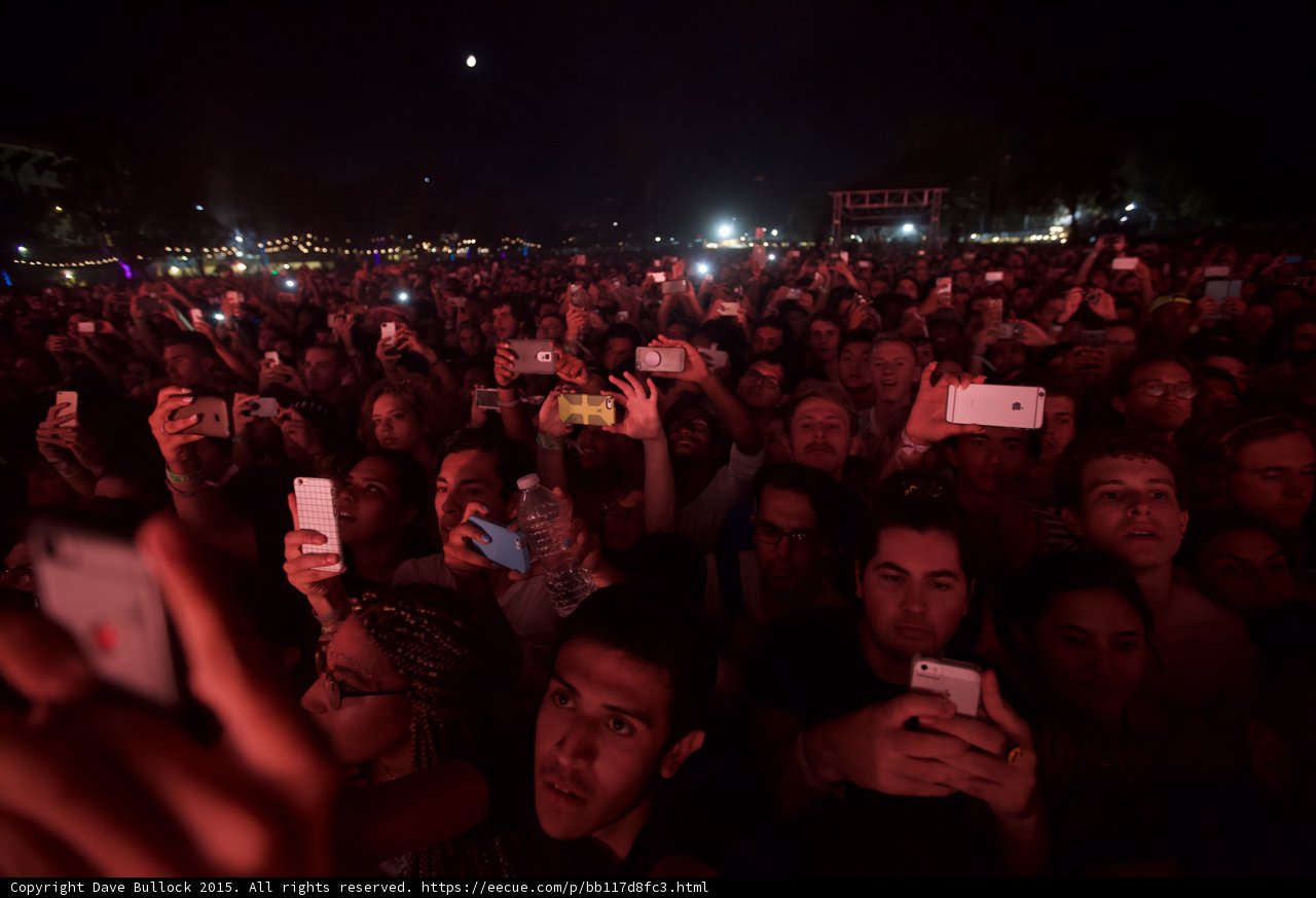 FYF Fest Crowd Moon Night Many Faces Phones Yellow Case Rose Gold iPhone Stage Scaffolding Red Lighting