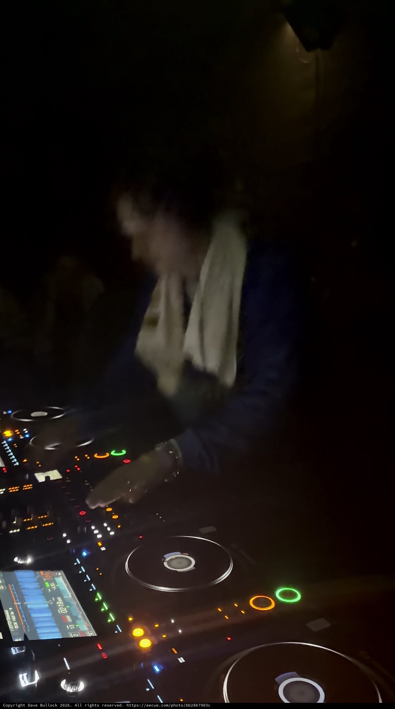DJ Performance in Dimly Lit London Nightclub