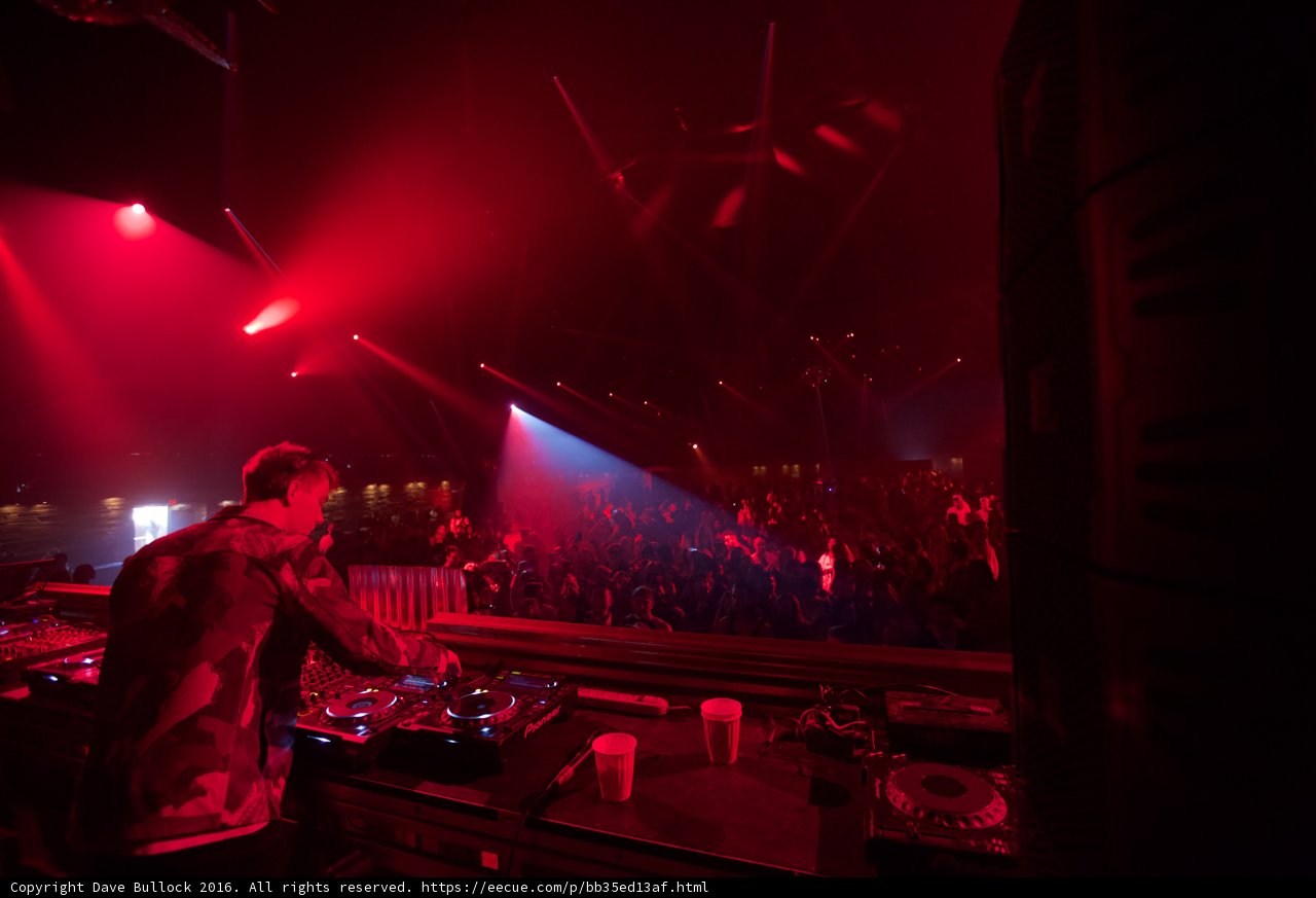Red-Lit DJ in the Urban Night