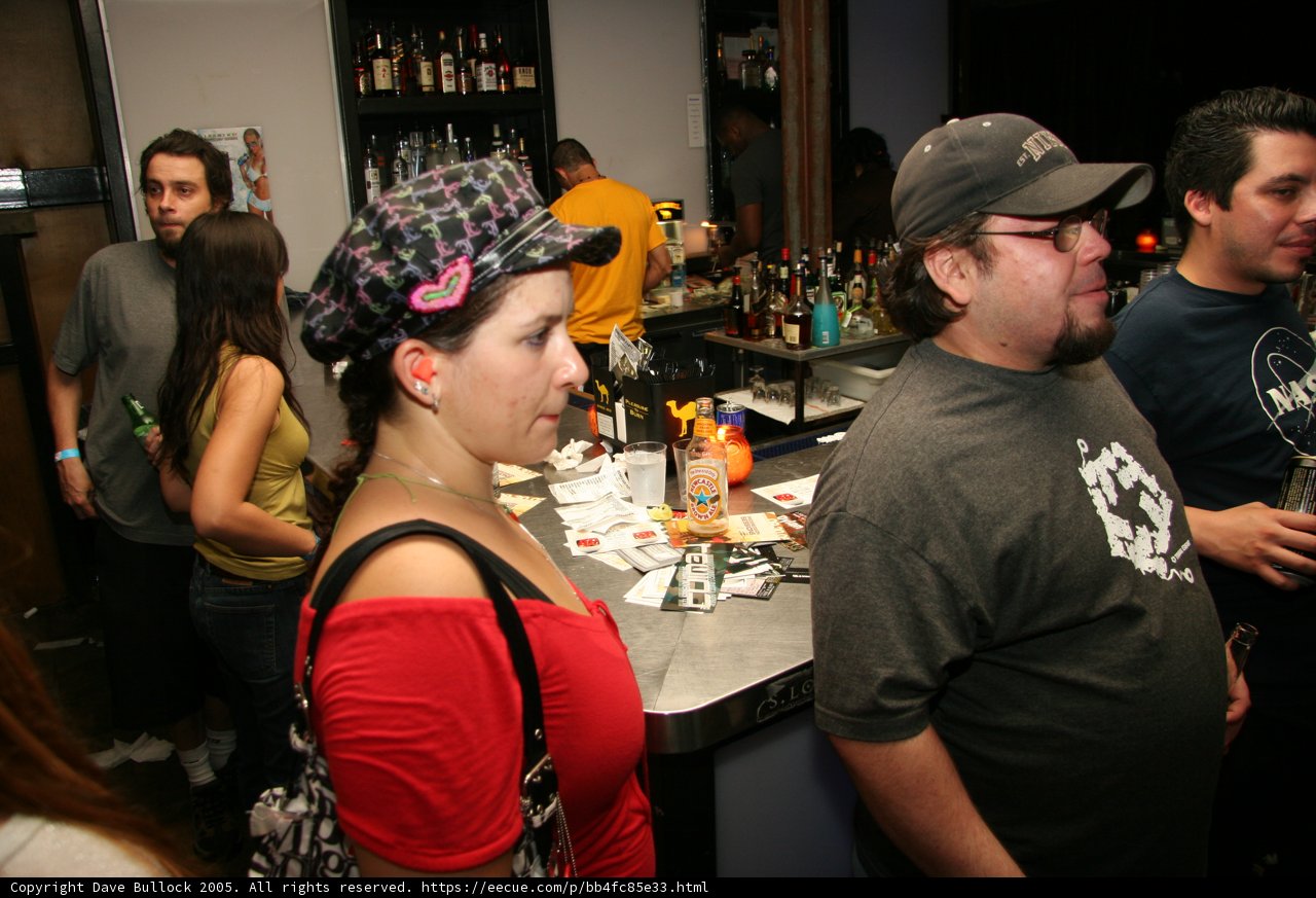 Man in Baseball Cap at Bar Counter