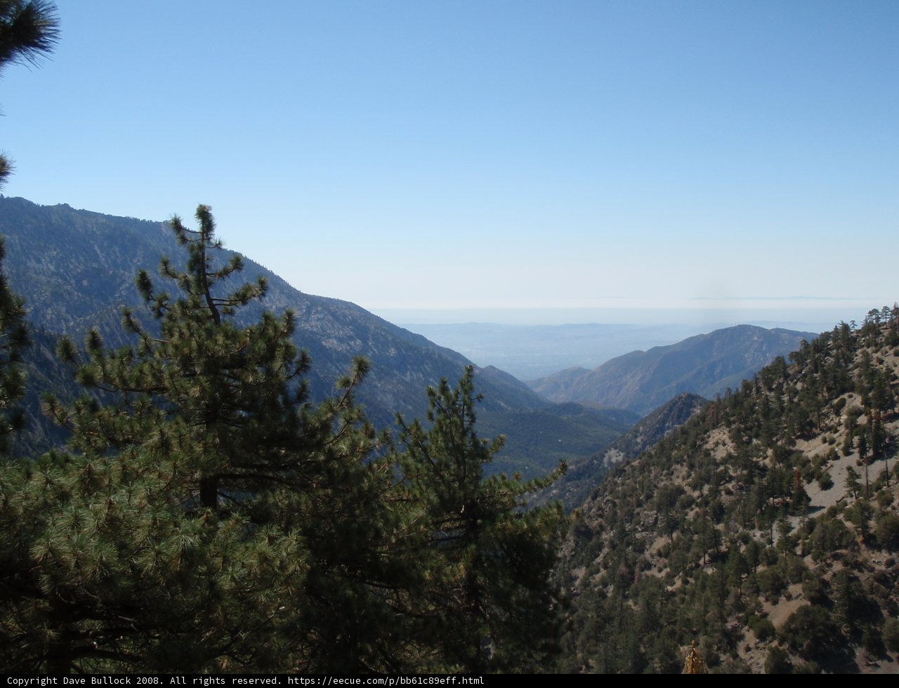 A scenic view of the mountain range from the peak
