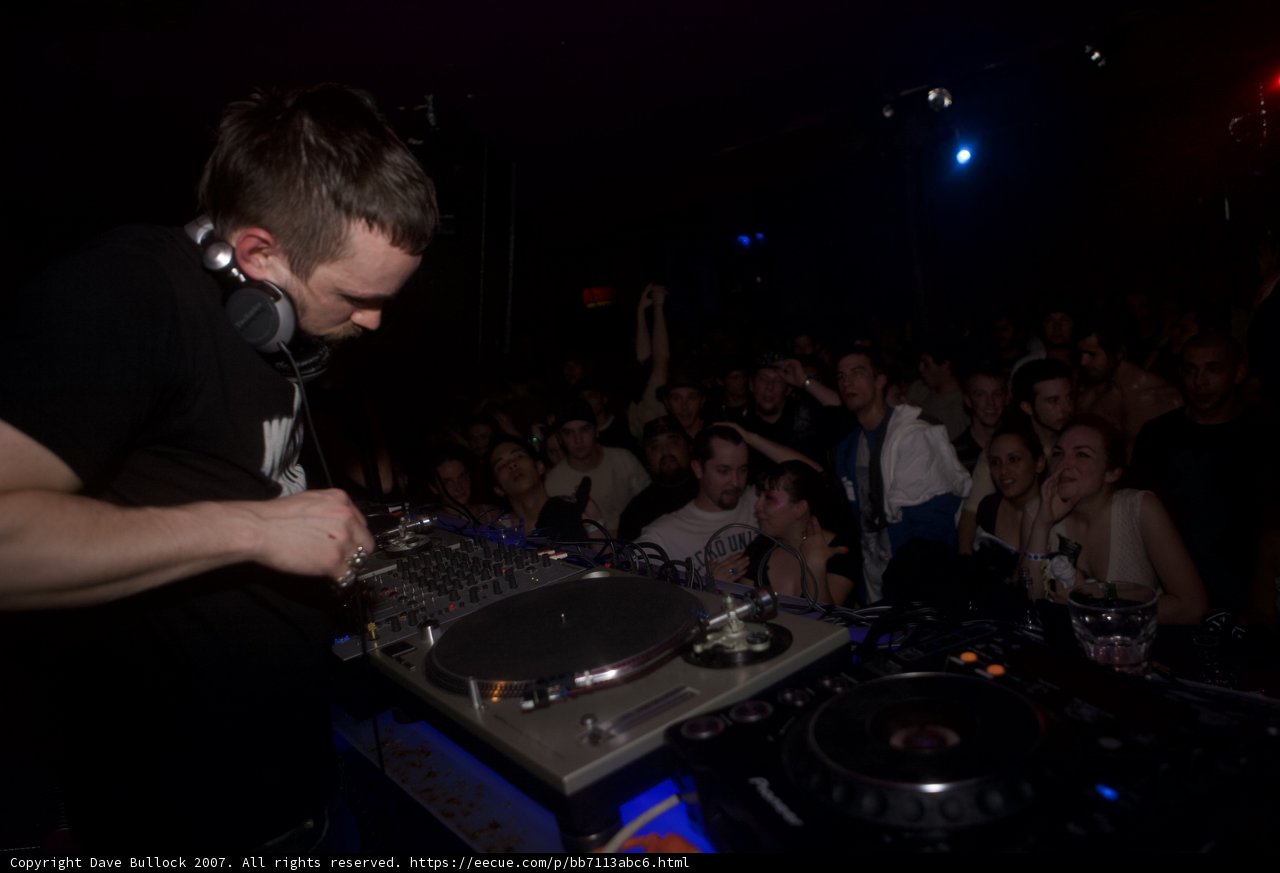 Grooving to the Beat: A DJ Set in a Packed Nightclub