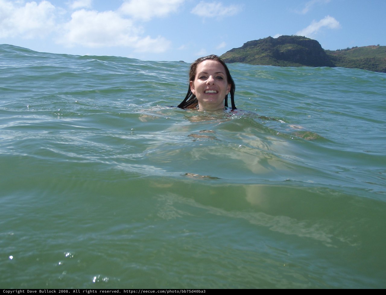 Smiling Woman Swimming in Hawaiian Ocean Waters