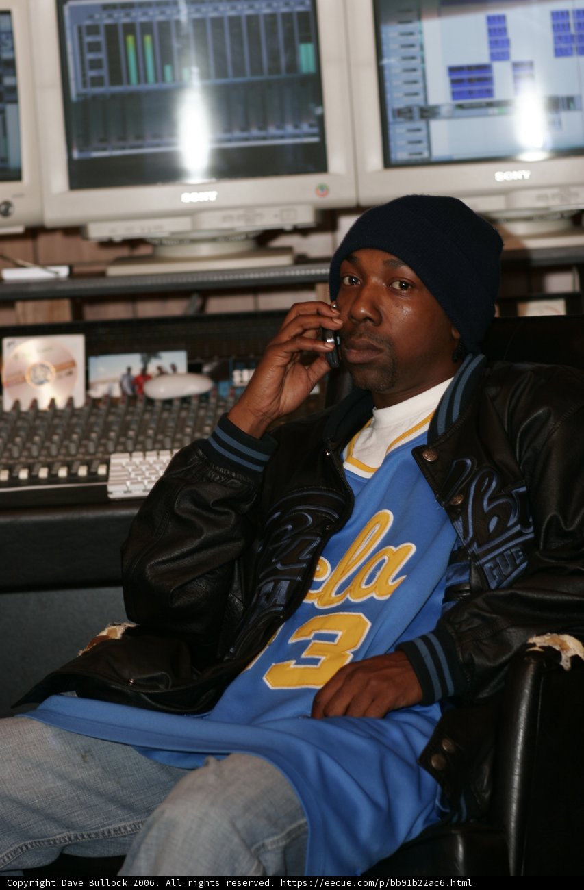 MC Eiht Rocks a Blue Jacket While on His Computer