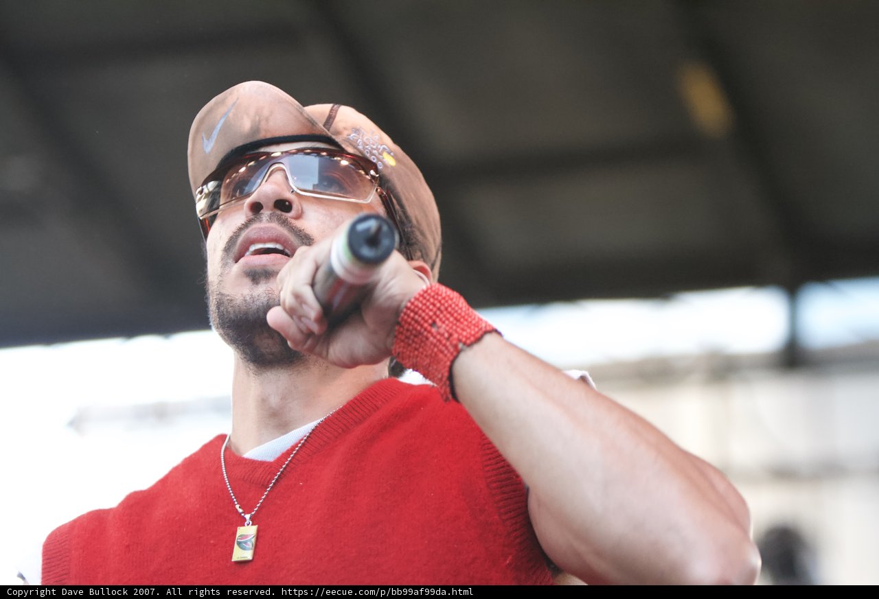 Red-Hatted Performer with Microphone