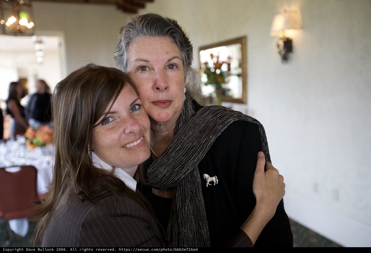 Two Women Share a Tender Moment at Gathering