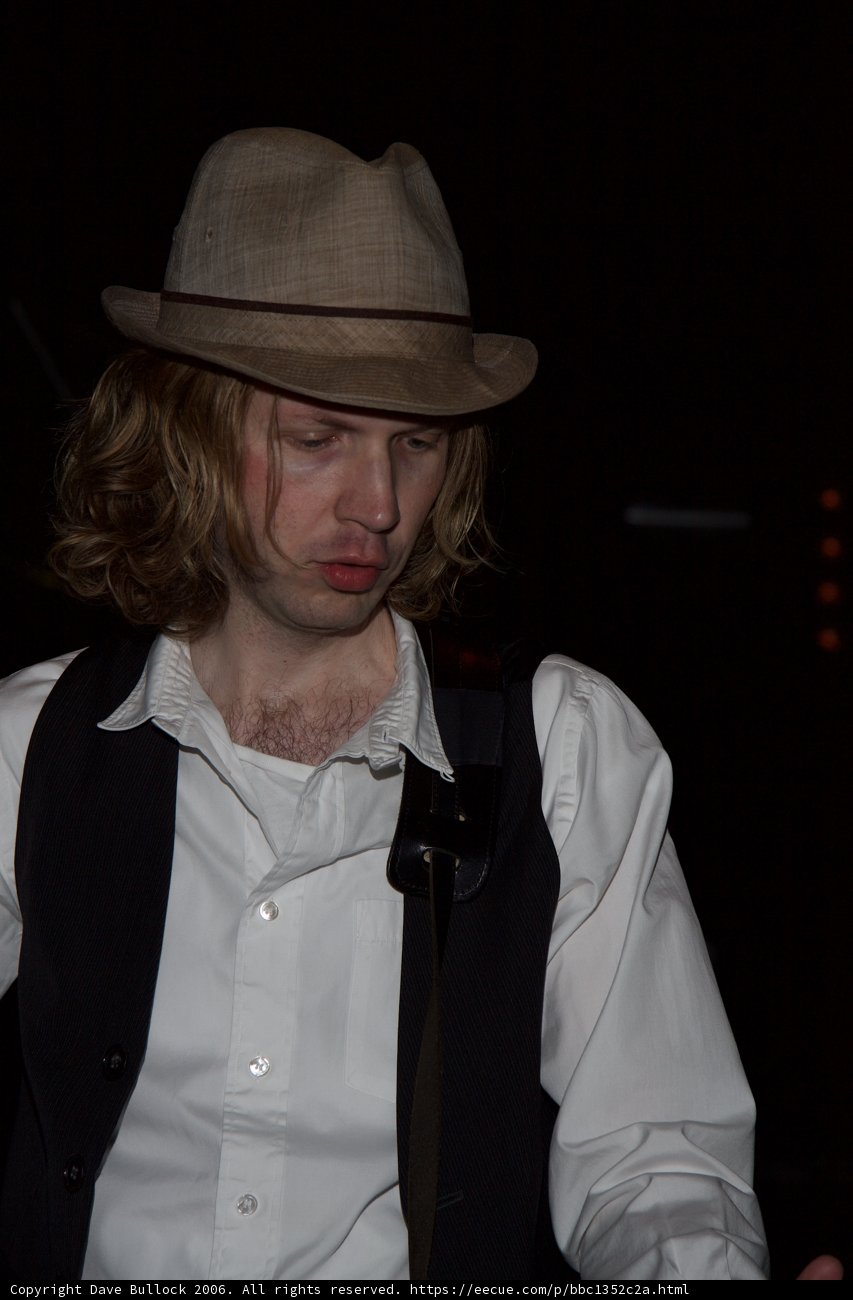 Beck sporting a stylish hat and vest