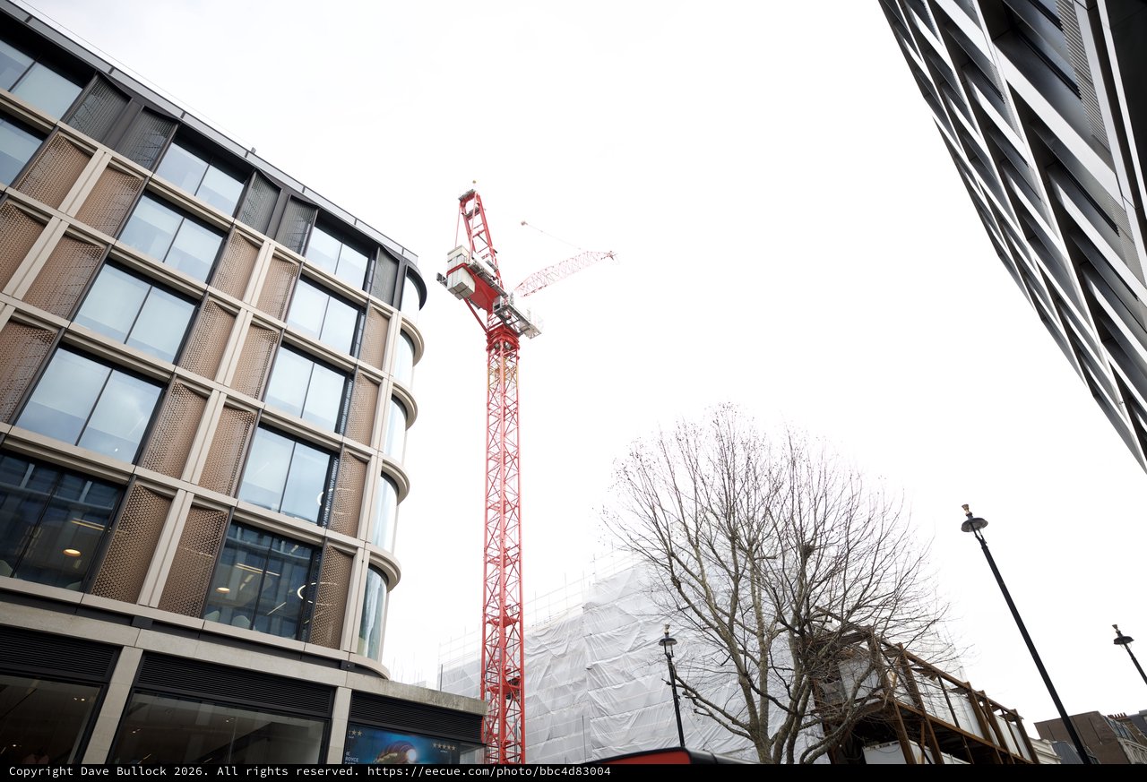 Red Construction Crane Between Modern London Buildings