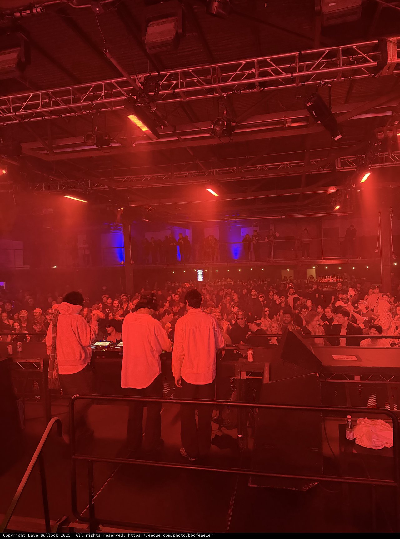 Electronic Music Event Under Dramatic Red Stage Lighting