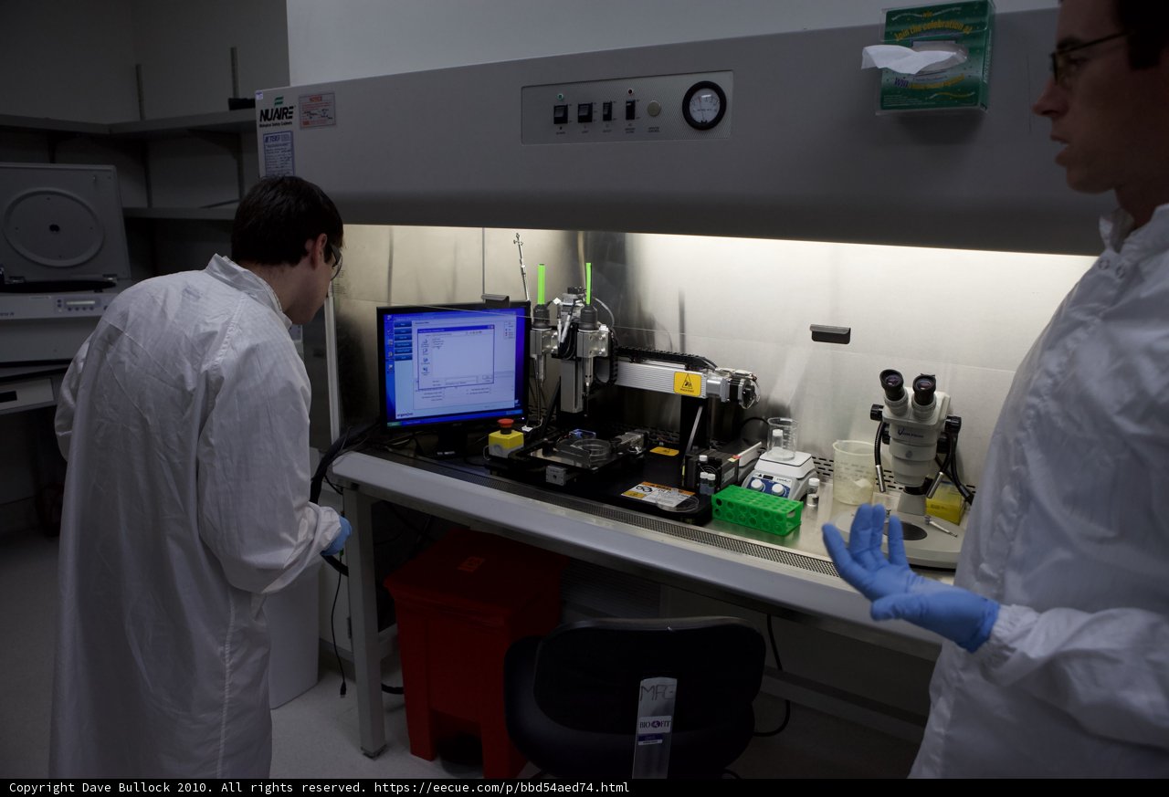 Lab Coated Men in Front of Computer Monitor