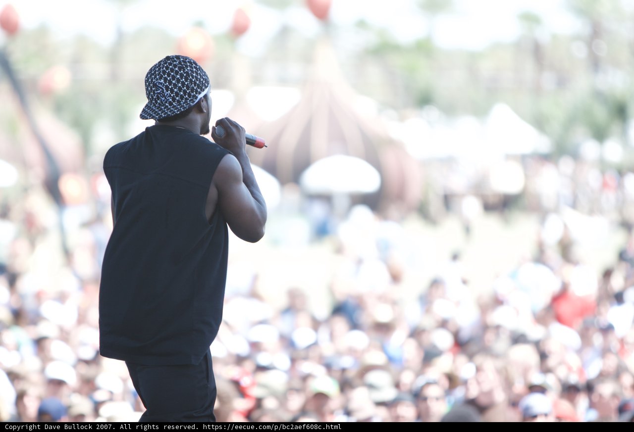 On Stage with a Black Shirt and Hat