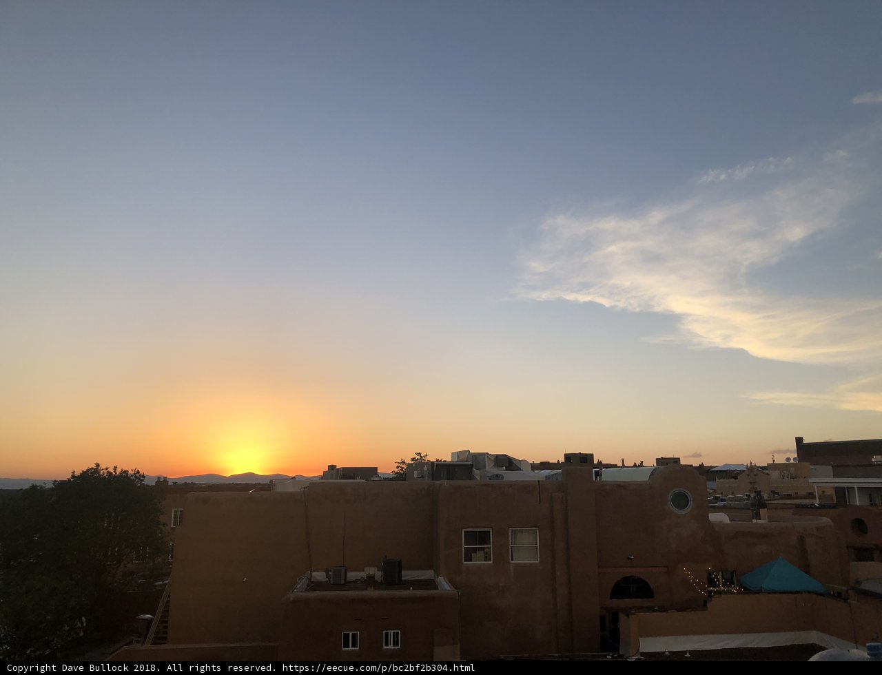 Adobe building glowing in sunset hues