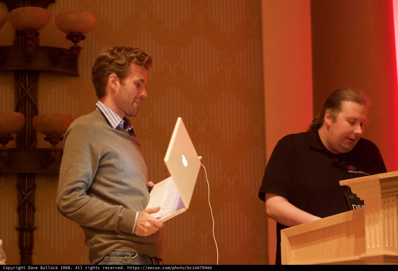 Man with Laptop at Conference