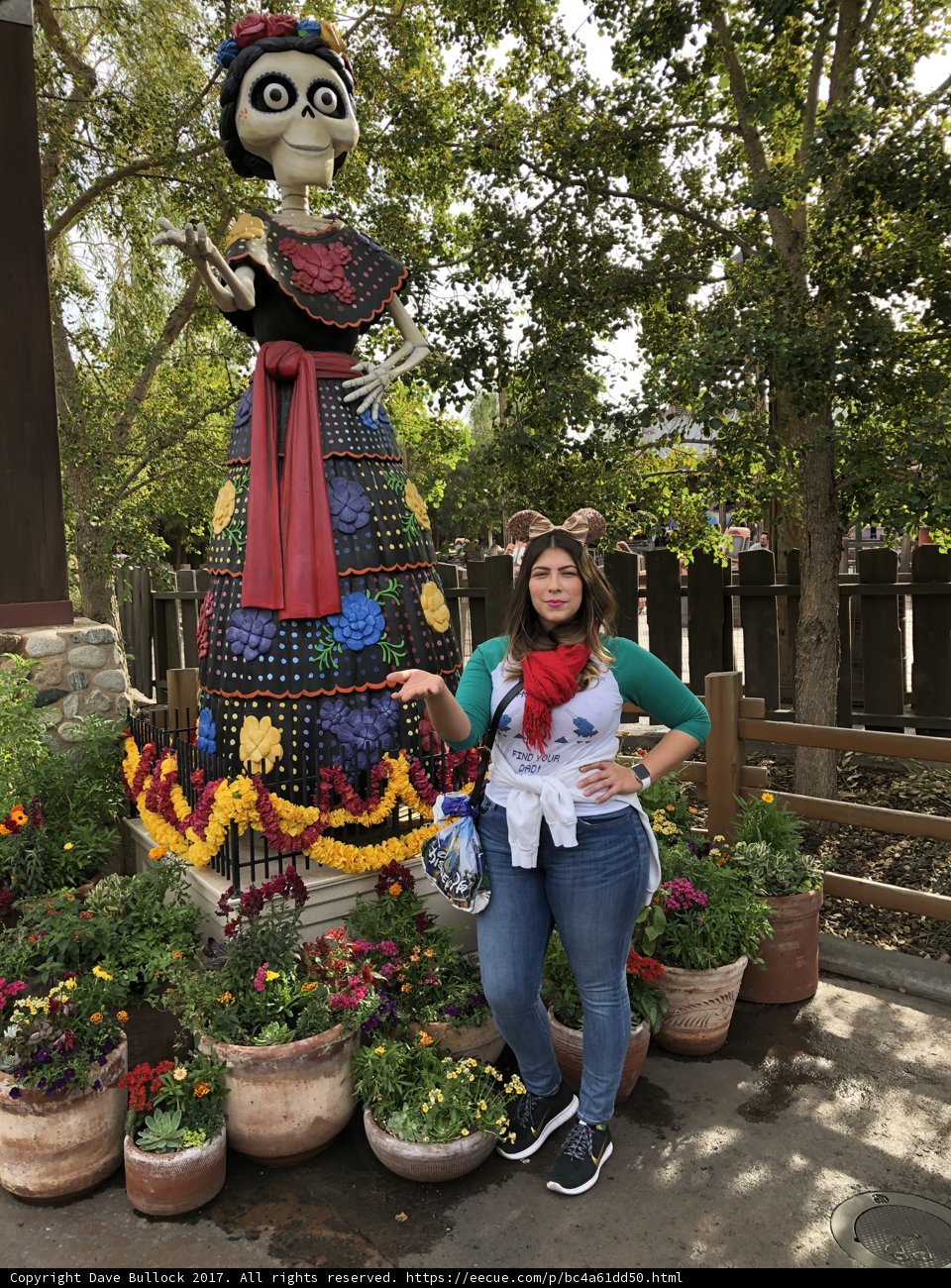 Woman Beside Statue in Garden