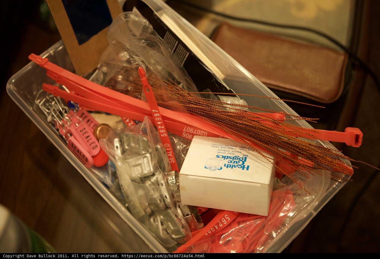 Assortment of Accessories in Plastic Container