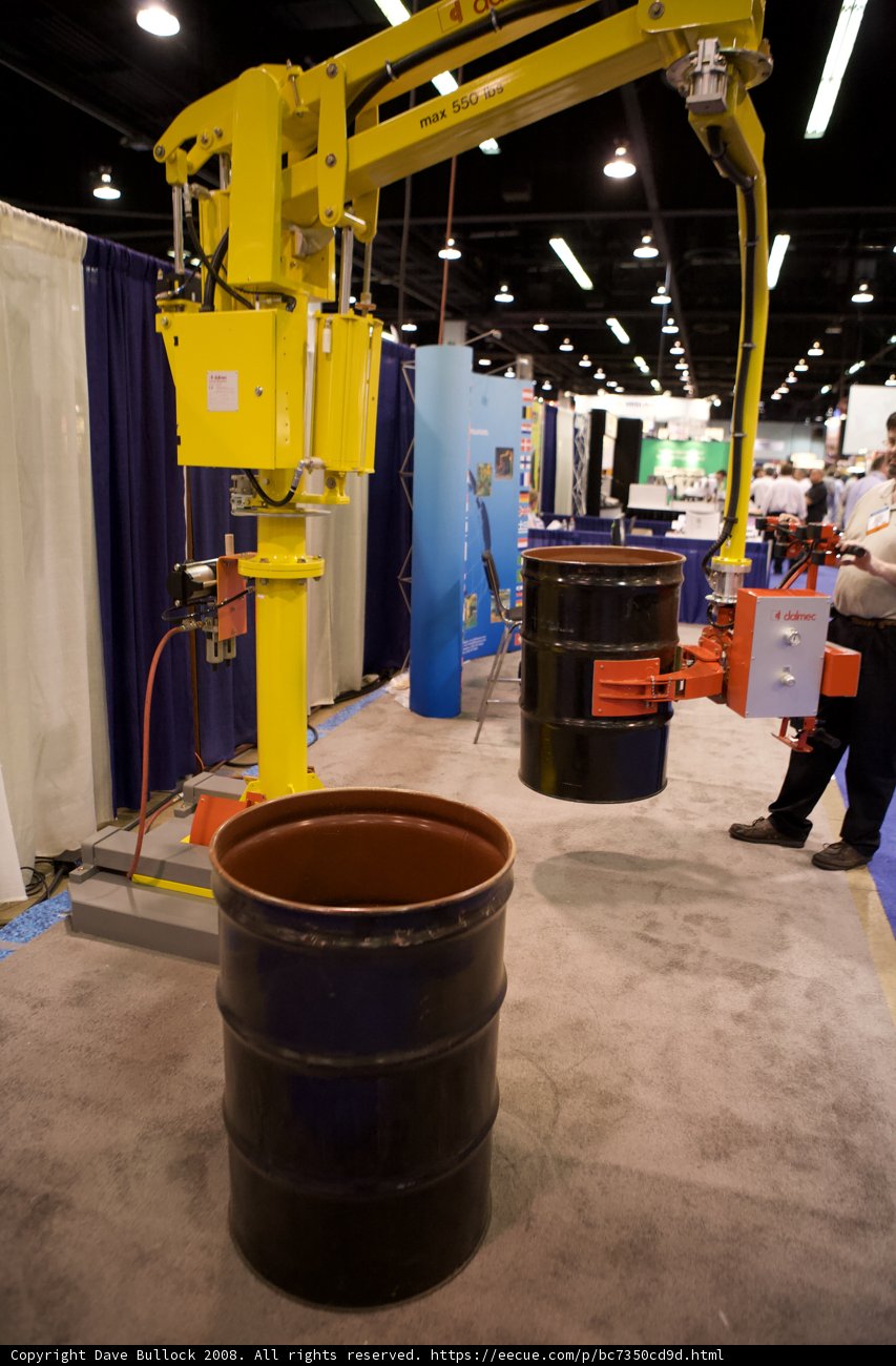 Factory Worker Beside a Large Barrel