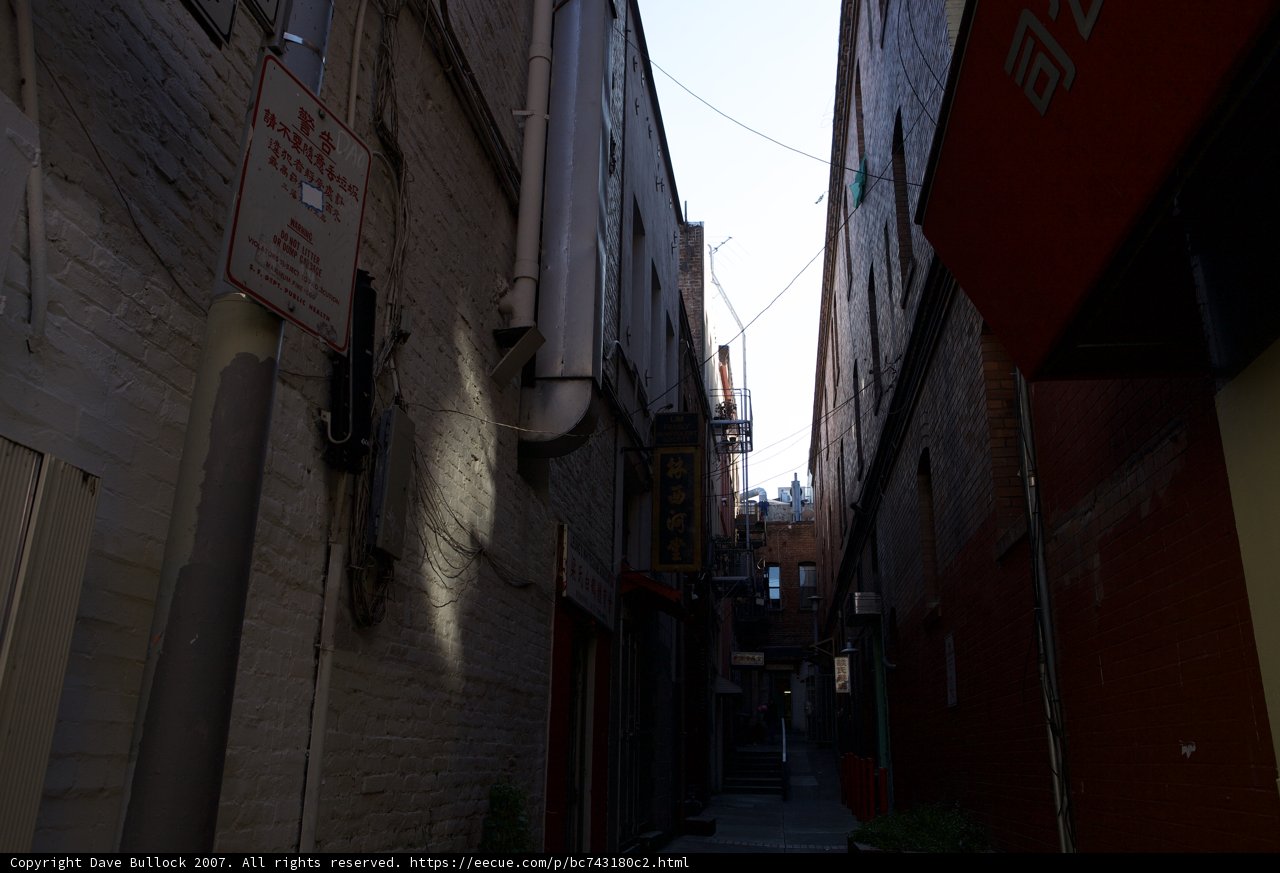 Red Sign in the Narrow City Alley