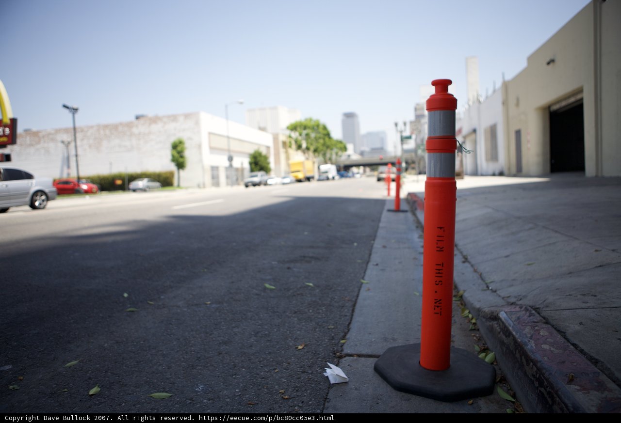 Red and White Traffic Cone on the City Street