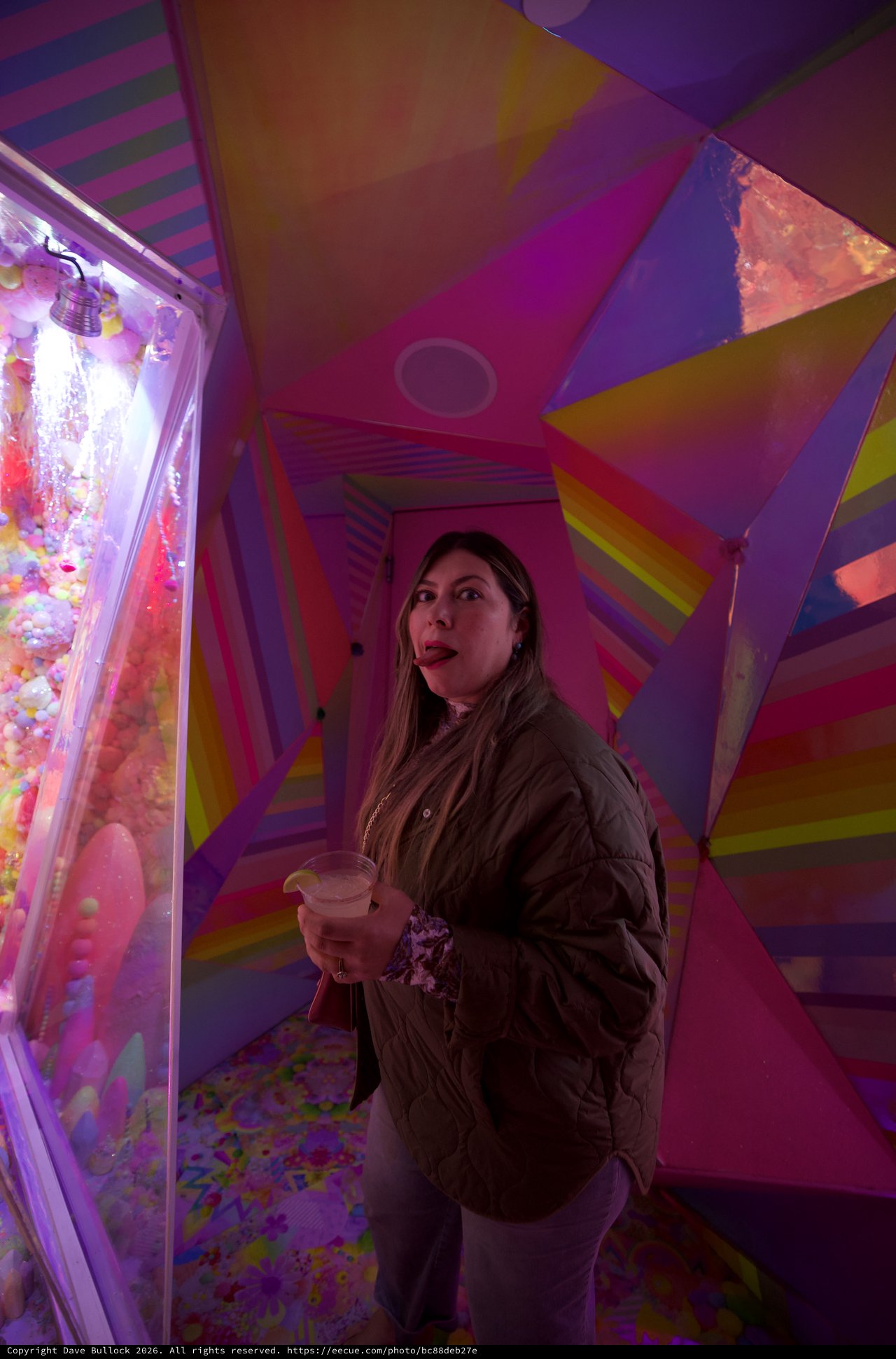 Woman Exploring Colorful Geometric Art Installation