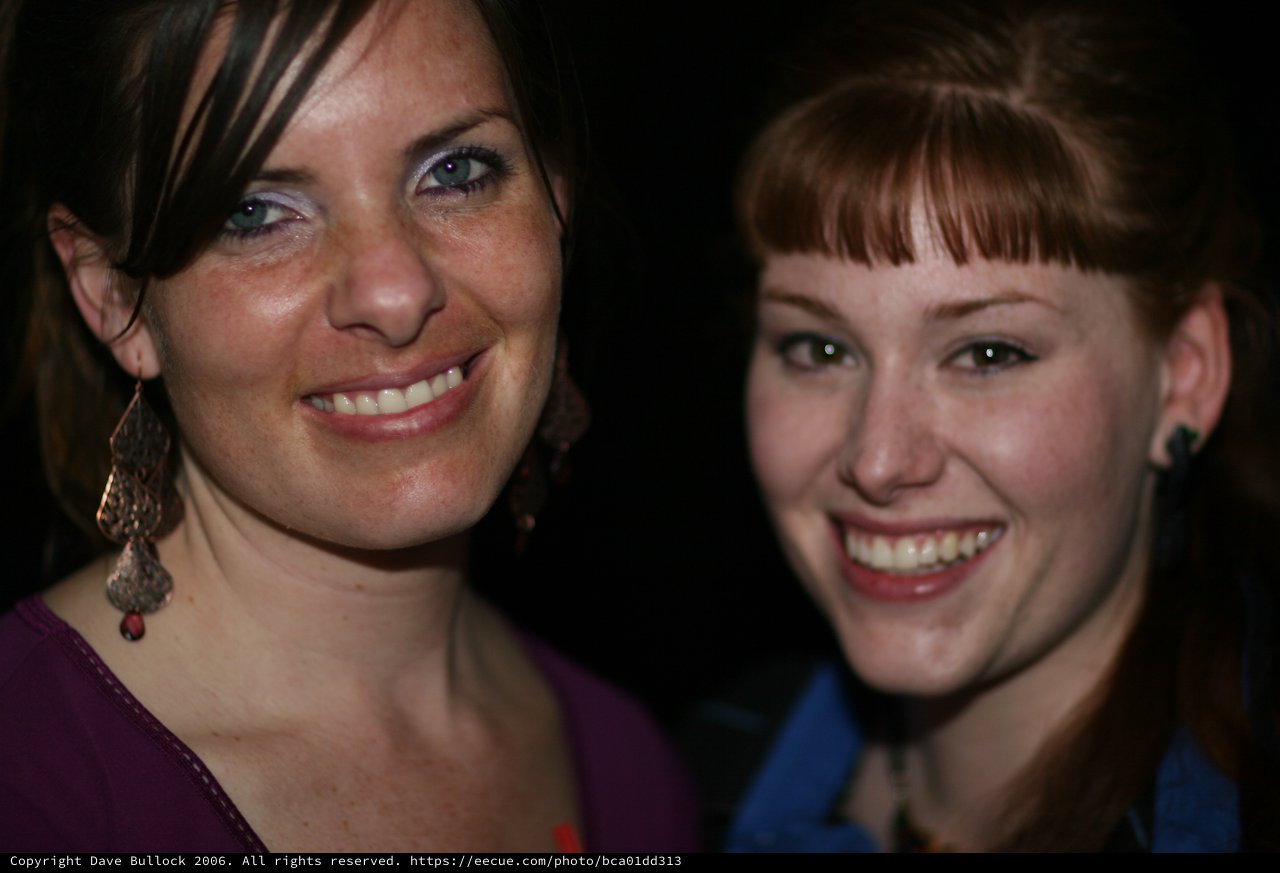 Two Smiling Women Share a Joyful Moment Together