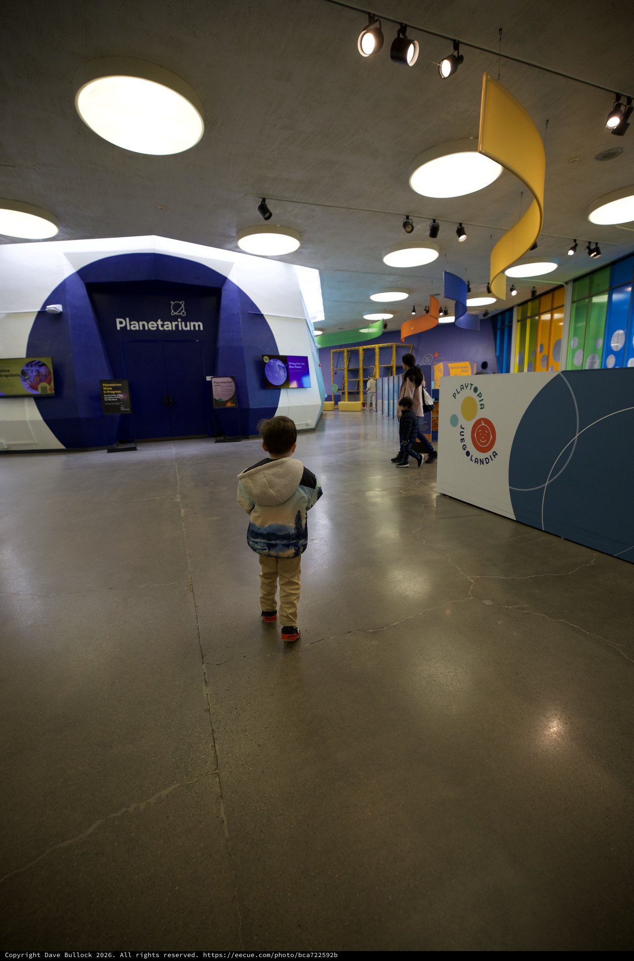 Child Explores Modern Interactive Science Museum Planetarium