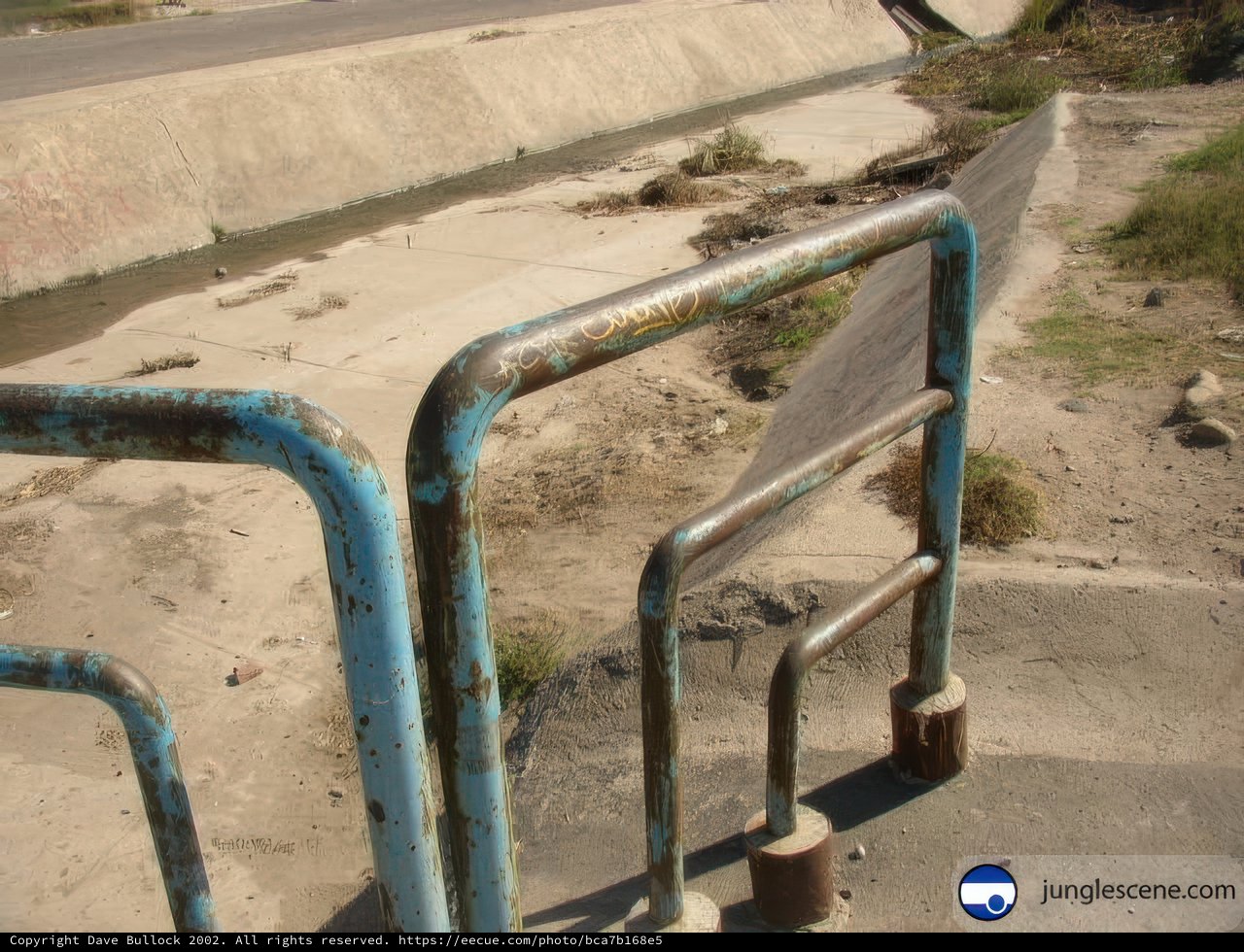 A Blue Metal Handrail Along the River