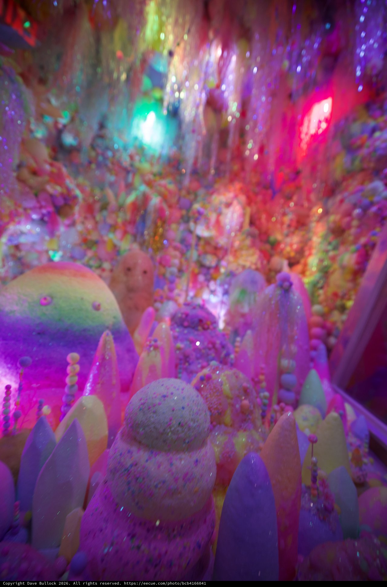 Vibrant Crystal Formations in Luminous Cave Display