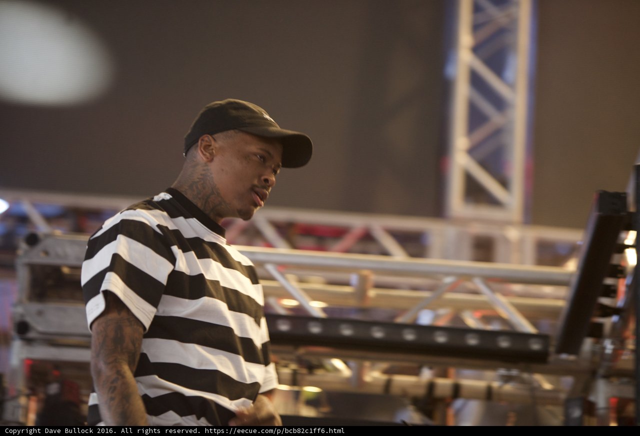 YG Takes the Stage in Stripes and Cap