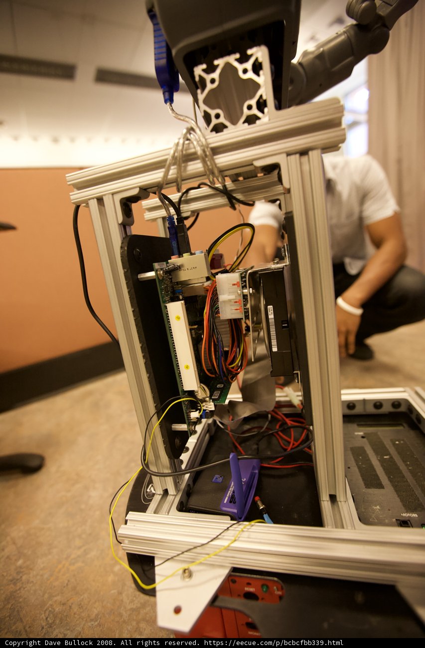 Man Working on Computer Inside Machine