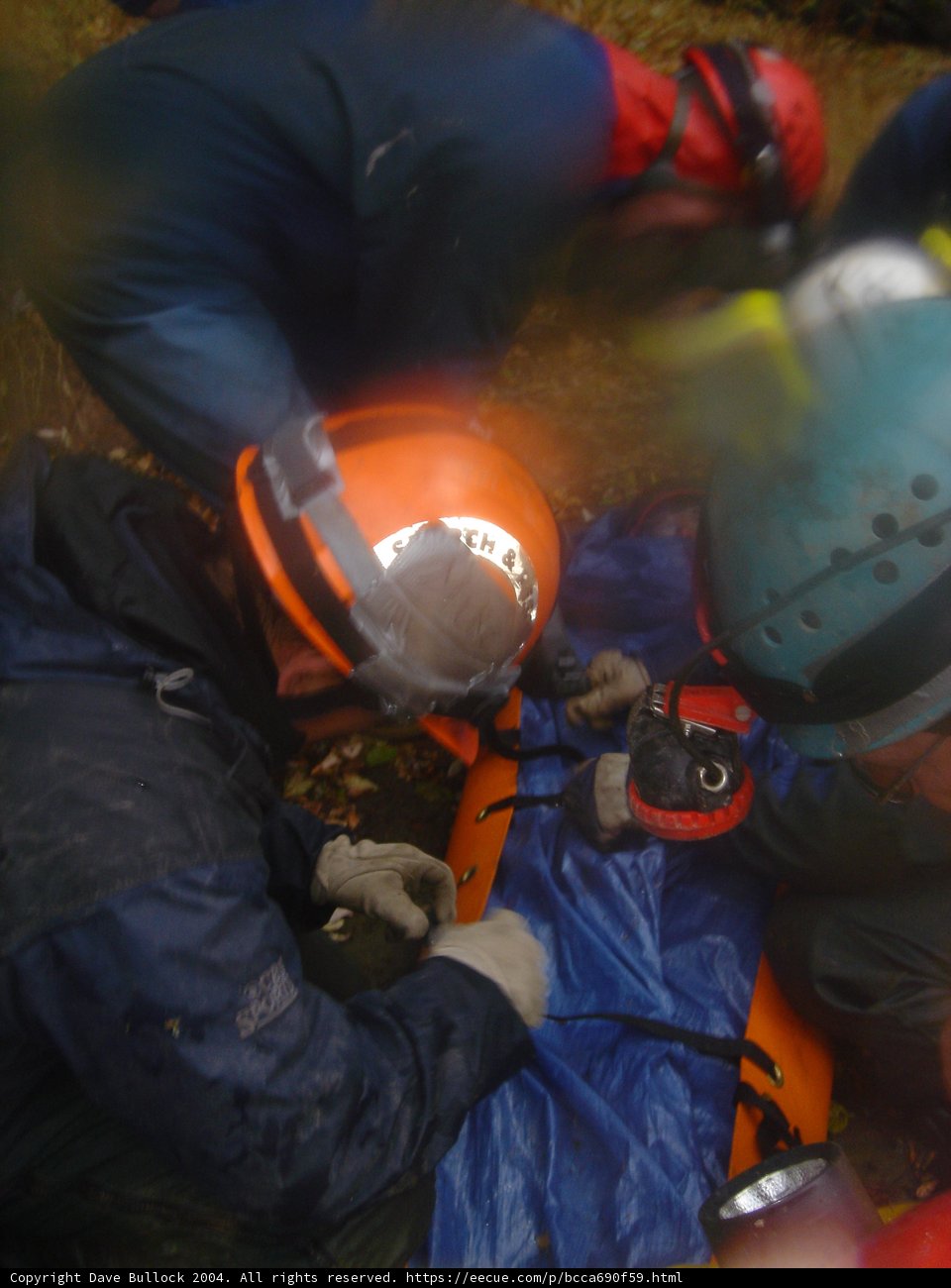 Rescue Workers in Protective Gear Work on Accident Victim